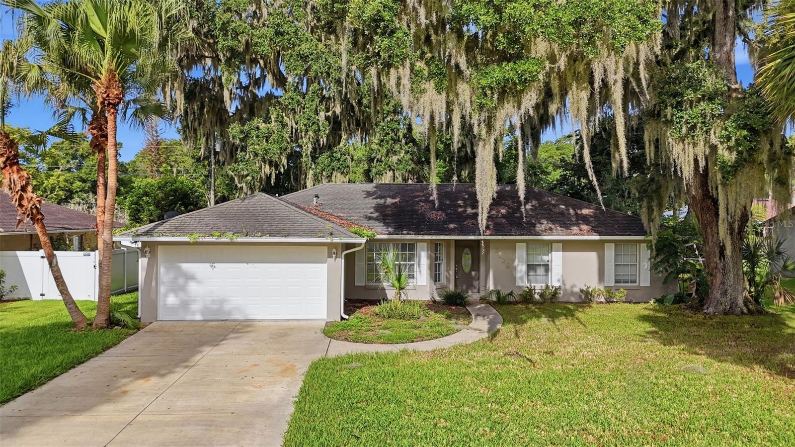 Welcome to 3128 Mango Tree Drive, Edgewater, where modern updates meet everyday comfort. This beautifully renovated 3-bedroom, 2-bathroom home offers over 1,600 square feet of thoughtfully refreshed living space, making it truly move-in ready.

Step inside to discover brand-new luxury vinyl plank flooring flowing throughout the home, complemented by fresh interior paint that creates a bright, inviting atmosphere. The exterior has also been freshly painted, providing excellent curb appeal and a clean, modern look.

The spacious floor plan offers comfortable living areas perfect for relaxing or entertaining, while the generous bedrooms provide plenty of space for family or guests. Built in 2002, the home offers approximately 1,617 square feet of living space.

Conveniently located just minutes from New Smyrna Beach, Canaveral National Seashore, shopping, dining, and I-95, you'll enjoy easy access to everything the Florida lifestyle has to offer. Whether you're searching for a primary residence, vacation home, or investment opportunity, this beautifully updated Edgewater home is one you won't want to miss.