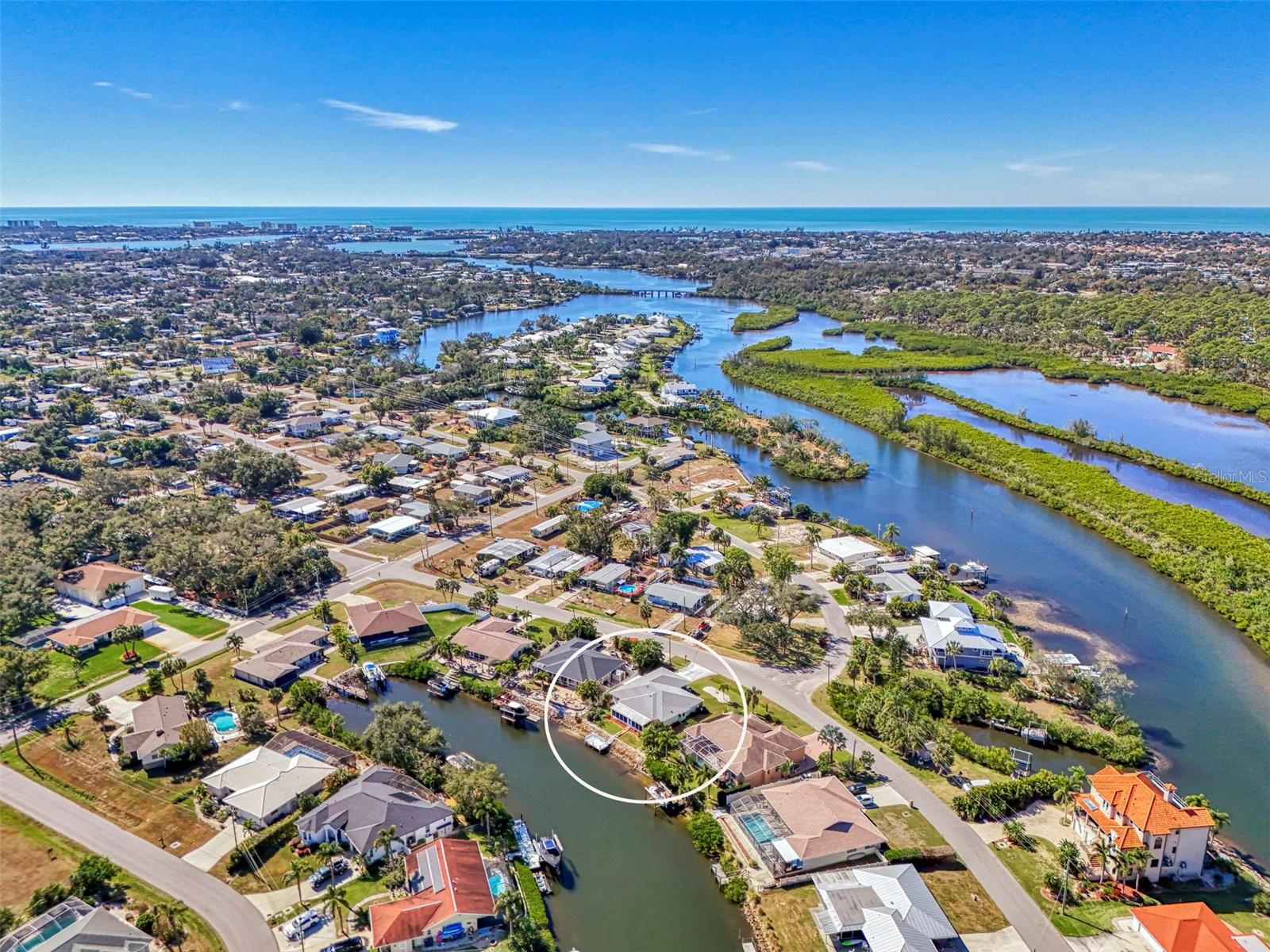 Enjoy serene waterfront living with 72 feet of canal frontage, Gulf access, and an existing dock, with room for a boat lift (buyer to verify). With easy access to the Intracoastal Waterway and the Gulf, this property is a dream for boating enthusiasts. The spacious home features a family room overlooking scenic Shakett Creek, offering a peaceful, ever-changing water view. An open floor plan with dual master suites provides flexibility for guests or multigenerational living. The kitchen includes an eat-in space, complemented by a formal dining area ideal for entertaining. Recent updates include a new roof (2023), new HVAC (2024), new water heater (2024), refrigerator (2024), and stove (2022). Conveniently located near the hospital, shopping, and many restaurants. Waterfront homes like this are hard to find—bring your decorating touches and create the waterfront lifestyle you’ve been dreaming of. Schedule your private showing today and experience the beautiful, relaxing water views for yourself.
