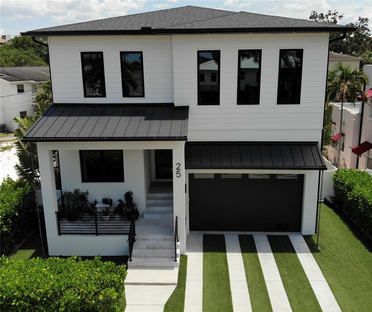 Under Construction. Currently under development, this exceptional two-story single-family residence is meticulously crafted for your utmost comfort and practicality. Situated on the serene and welcoming Geneva Place on Davis Islands, this location remains one of the area's best-kept secrets. Boasting a 2-car garage, a pool/spa combination, an outdoor grilling area, and two expansive levels of living space, this home offers 4 bedrooms, 4 bathrooms, and nearly 4,000 square feet of heated living area.

The ground floor features a spacious great room/kitchen duo equipped with top-of-the-line Professional GE Monogram appliances, wine and beverage refrigerators, a generous dining space, and a convenient mudroom adjacent to the garage. Additionally, a first-floor bedroom with an attached bath and walk-in closet is also present.

Ascending to the upper floor, you will discover a luxurious master suite with a sizable sitting area, custom his and hers closets, and a spa-like bathroom with a freestanding tub. Two more bedrooms with en-suite bathrooms, a versatile flex room suitable for various uses, and a laundry room complete the second level.

The outdoor area is designed for seamless Florida entertainment, featuring a saltwater pool, a sun shelf, and spa by Blue Sky Pools, all enclosed within a fully fenced and landscaped backyard. Noteworthy features of this turnkey residence include icynene open-cell foam insulation in the attic and between floors, Gypcrete installation on the second level, sound barrier Batt insulation, a 16 SEER split HVAC system, pre-wiring for security cameras and multi-zone music systems, low-E impact-rated windows and doors, built-in home pest defense tubes, and an automated Rainbird irrigation system. The lofty garage ceilings provide ample space for the buyer to easily install a car lift.

Located on beautiful Davis Islands a short distance from the walking and bike path and a short distance from Davis Islands Village with many restaurants, shops, and bars. Bring your golf cart and enjoy the Island lifestyle with walking / biking paths, baseball fields, public tennis courts, public historic pool, two dog parks, a beach, public marina, and an airport. Additionally, located only minutes from Downtown Tampa, Water Street, Sparkman Wharf, and the Tampa Riverwalk, makes this neighborhood the most desired in South Tampa.