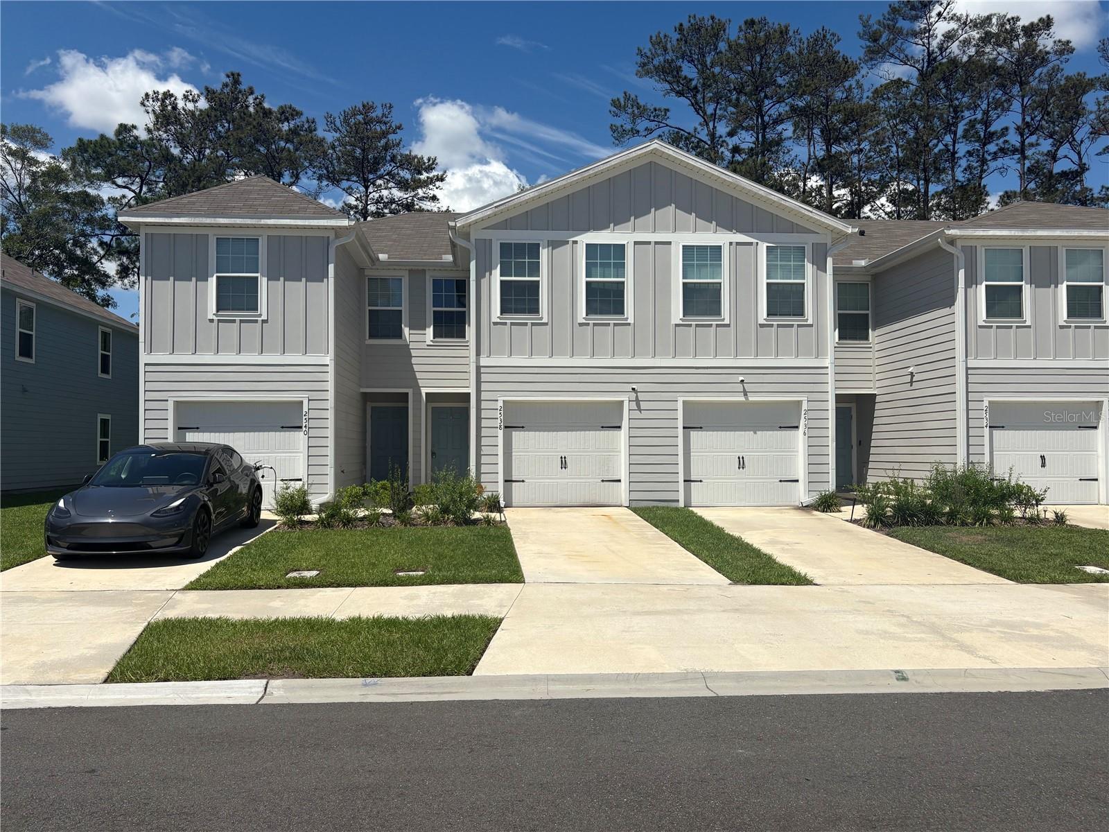 Short Sale. Welcome to this beautifully designed 3-bedroom, 2.5-bath townhome built in 2024 in the desirable Sadler Trace Townhomes community. This two-story home features an open-concept floor plan with a spacious living and dining area, modern kitchen with island, pantry, and stainless-steel appliances. Upstairs offers a split-bedroom layout including a generous primary suite with walk-in closet and private bath. Additional highlights include tile flooring in main living areas, attached 1-car garage, covered patio, and low-maintenance living with HOA-managed exterior services. Conveniently located near shopping, dining, schools, and major roadways with easy access to downtown Jacksonville and NAS Jacksonville.