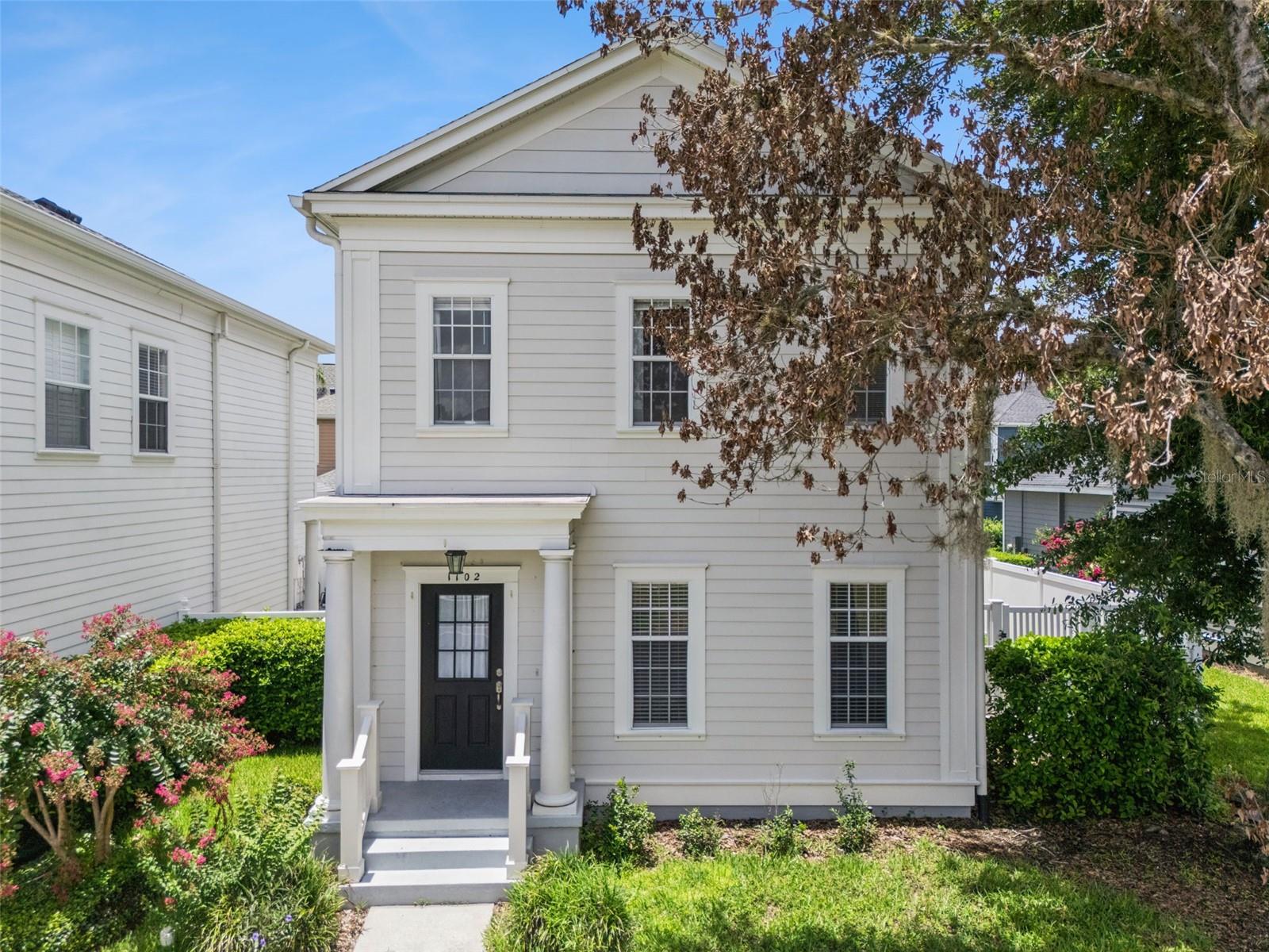 Here's your opportunity to own a beautifully updated, income-generating home in the highly sought-after East Village of Celebration. Nestled on a quiet cul-de-sac overlooking a scenic park, this exceptional 4-bedroom, 3.5-bath residence (including the garage apartment) with a detached 2-car garage and private one bedroom garage apartment offers the perfect blend of comfort, style, and investment potential. Step inside to an open, inviting floor plan featuring Pergo waterproof flooring throughout the main level. The beautifully remodeled kitchen is the heart of the home, showcasing elegant quartz countertops, updated cabinetry, and modern finishes that make everyday living and entertaining effortless. A convenient built-in drop zone keeps everything organized, while the renovated powder bath (2022) adds a fresh designer touch. Major updates include a new roof (2021), A/C (2018), privacy fence, and updated landscaping, providing peace of mind for years to come. Enjoy Florida living outdoors on the charming brick patio overlooking the tranquil park setting, creating the perfect backdrop for morning coffee, evening gatherings, or simply relaxing in your own backyard. Whether you continue leasing the garage apartment for supplemental income, use it as a private guest suite, home office, or space for extended family, this versatile apartment adds tremendous value and flexibility. Celebration, originally developed by Disney, is one of Central Florida's most sought-after communities, known for its timeless architecture, tree-lined streets, welcoming front porches, and vibrant small-town atmosphere. Residents enjoy more than 26 miles of walking and biking trails, multiple community pools, parks, playgrounds, sports courts, and a lively downtown filled with locally owned restaurants, boutiques, cafés, and year-round community events. This home is approximately a 1.5-mile walk to Downtown Celebration, making it easy to enjoy weekend farmers markets, holiday festivities, lakeside dining, and everything this charming community has to offer. Conveniently located just minutes from Walt Disney World, championship golf, major highways, Orlando International Airport, and world-class shopping, dining, and entertainment, this home offers the perfect balance of peaceful community living and easy access to all that Central Florida has to offer. With tasteful updates, a premium East Village location, scenic park views, and an income-producing garage apartment, this is a rare opportunity to own one of Celebration's most desirable properties.