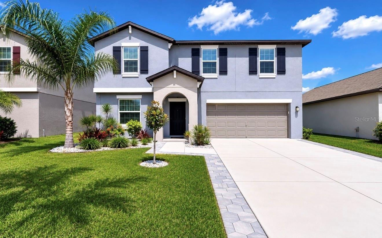 **FLORIDA LIVING AT ITS FINEST WITH A HEATED SALTWATER POOL & SPA + STUNNING POND VIEW!**Welcome home to this beautifully upgraded 2023-built retreat featuring 4 bedrooms, 2.5 bathrooms, a flex room, loft, and 2,635 heated sq ft—complete with a stunning heated saltwater pool and spa overlooking peaceful pond views for the ultimate Florida lifestyle! From the moment you arrive, the expanded driveway, upgraded landscaping, and inviting curb appeal immediately set this home apart. Step inside to a welcoming foyer where the versatile flex room offers endless possibilities for a home office, gym, playroom, or additional living space. The home then opens into a spacious and inviting layout where the well-appointed kitchen, dining area, and living room flow effortlessly together, creating the ideal setting for everyday living and entertaining. The beautifully updated kitchen showcases a modern subway tile backsplash, stylish pendant lighting, updated fixtures, spacious island with breakfast bar seating, stainless steel appliances, and abundant cabinetry, all overlooking the heart of the home. The living room is truly a standout feature, highlighted by a stunning custom accent wall complemented by an electric fireplace, adding warmth, style, and character to the space. A conveniently located half bath and direct garage access complete the first floor. Upstairs, a generously sized loft featuring another custom accent wall provides the perfect second living area, media room, or play space. The private owner’s suite is thoughtfully positioned away from the secondary bedrooms, creating a peaceful retreat complete with a spacious layout, an impressive walk-in closet, and a well-appointed en-suite bathroom featuring a dual sink vanity, granite countertops, and a step-in shower. Three additional bedrooms and a full bathroom are located on the opposite side of the home, while the upstairs laundry room adds everyday convenience. Step outside to your own backyard paradise where the true showstopper awaits! The heated saltwater pool and spa, complete with beautiful lighting, expansive decking, an expanded screened lanai, and a fully fenced yard, create the ultimate private outdoor retreat to relax, entertain, or enjoy the tranquil pond views and breathtaking Florida sunsets. Whether hosting family and friends or unwinding after a long day, this outdoor space was designed to impress. Additional highlights include exterior security cameras, a 220V garage outlet ready for an EV charger, and thoughtful upgrades throughout that elevate both style and functionality—making this move-in-ready home truly stand out from the rest. Residents of Berry Bay enjoy a low HOA and an impressive selection of resort-style amenities, including a zero-entry pool, clubhouse, picnic areas, dog park, playground, basketball courts, and pickleball courts. Ideally situated near major roadways with convenient access to Tampa, Sarasota, St. Petersburg, award-winning Gulf beaches, airports, shopping, dining, entertainment, theaters, and professional sporting events, this like-new home offers the perfect combination of space, privacy, and convenience. Offering the perfect blend of comfort, style, and resort-style living, this exceptional move-in-ready home is ready to welcome its next owners—schedule your private tour today!