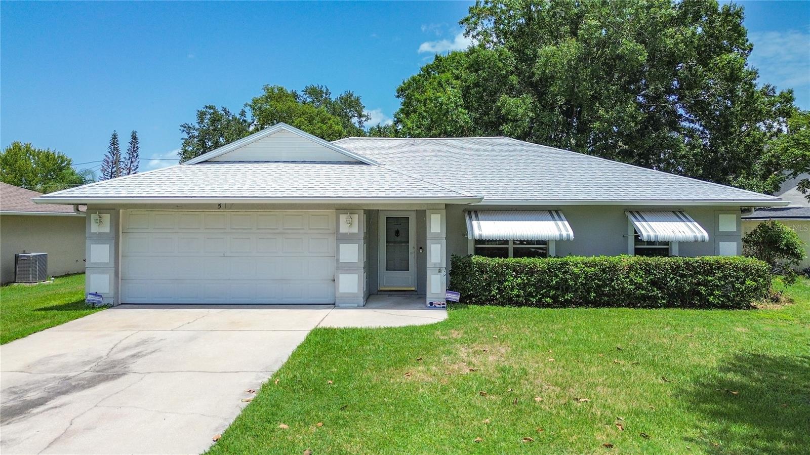 Welcome home to this well-maintained 3-bedroom, 2-bath concrete block home in one of St. Cloud's most desirable locations! Situated on an oversized .26-acre lot, this property is just 5 blocks from the beautiful St. Cloud Lakefront, marina, Crabby Bill's, and 5 blocks from historic downtown with its charming shops, restaurants, and nightlife. Built for peace of mind, this home features a new roof (2021) with gutters, a regularly serviced Trane HVAC system, and a high-and-dry homesite. Inside, you'll find the great room with vaulted ceilings, a functional split-bedroom layout, and the kitchen overlooking the dining area—creating an ideal layout for both everyday living and entertaining. The primary suite offers a private bath with a walk-in shower and a generous 5' x 7' walk-in closet. The kitchen includes all appliances, and the washer and dryer are included in the attached 2-car garage. Enjoy Florida living from the screened rear porch, overlooking a large, fully fenced backyard with a vinyl privacy fence and a storage shed with loft—perfect for tools, hobbies, or extra storage. No fees, no HOA, and plenty of room to add a pool! Lovingly cared for over the years, this home offers the perfect opportunity to add your own style while enjoying solid construction, a desirable floor plan, and an unbeatable location close to the lakefront, downtown, schools, shopping, medical facilities, major roadways, and everyday conveniences.