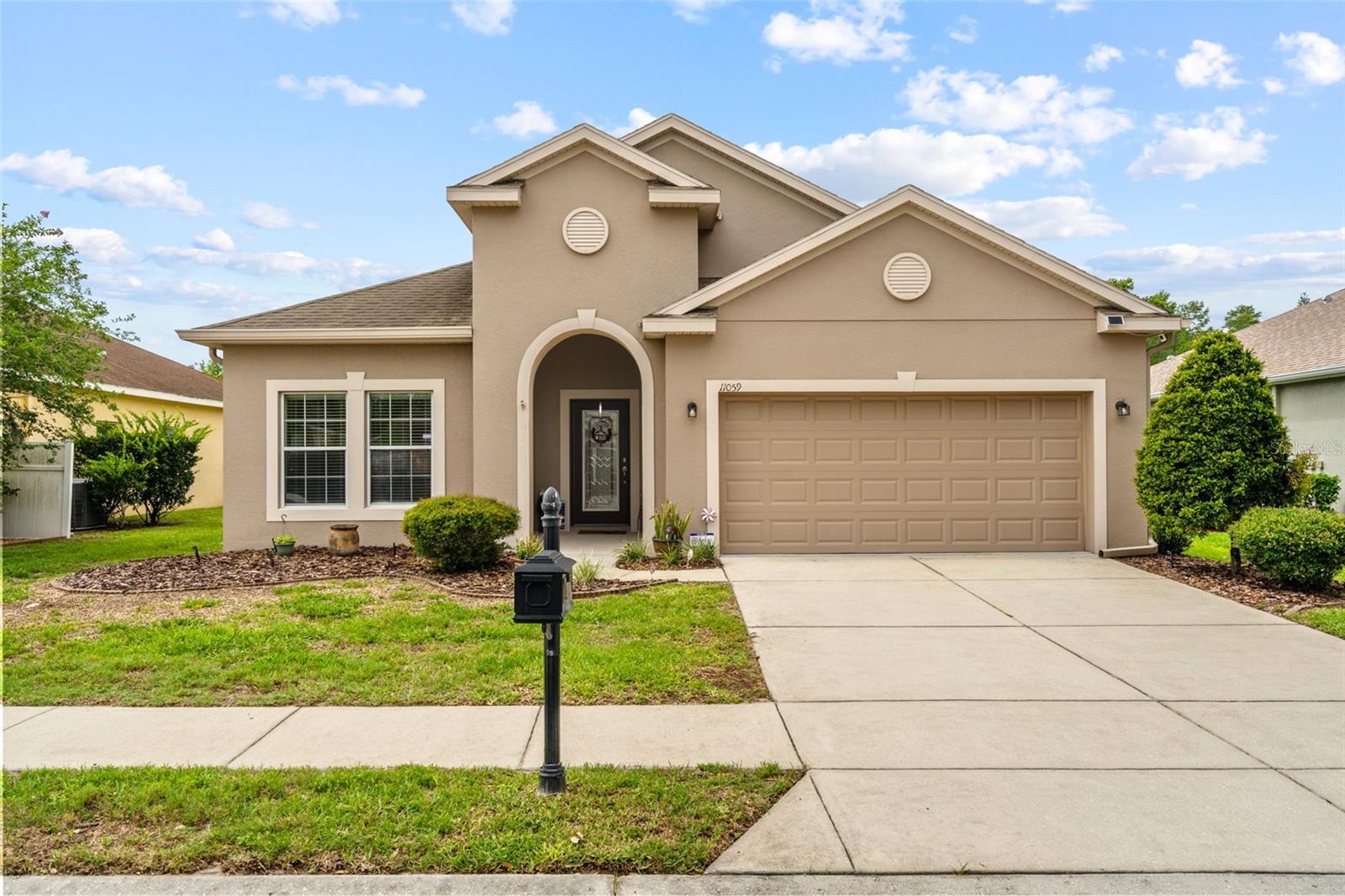 WELCOME TO PARADISE IN WATERS EDGE! Nestled on a premium conservation homesite with no rear neighbors, this beautifully maintained 4-bedroom, 2-bathroom home with a 2-car garage offers the perfect combination of privacy, comfort, and resort-style living. From the moment you arrive, you'll appreciate the pride of ownership throughout. Step inside to discover an inviting open floor plan featuring newer wood flooring throughout the main living areas, tile in all wet areas, abundant natural light, and a layout designed for both everyday living and entertaining. The spacious kitchen opens seamlessly to the living and dining areas, creating the ideal gathering space for family and friends. The split-bedroom floor plan provides privacy for the owner's retreat while offering generous secondary bedrooms for family, guests, or a home office. Step outside and enjoy your own private backyard oasis overlooking peaceful conservation views. With no rear neighbors, you'll love relaxing with your morning coffee, entertaining guests, or simply enjoying Florida's beautiful weather in complete tranquility. Located within the highly desirable gated community of Waters Edge, residents enjoy an incredible collection of resort-style amenities including a spectacular clubhouse, state-of-the-art fitness center, resort-style swimming pool, splash pool, playgrounds, basketball and pickleball courts, fishing piers, boat dock access, parks, walking areas, and numerous community activities throughout the year. Waters Edge is surrounded by natural beauty while remaining conveniently located near top-rated schools, shopping, restaurants, medical facilities, Starkey Wilderness Preserve, Gulf beaches, and the Suncoast Parkway for an easy commute to Tampa. Homes on conservation lots in Waters Edge are highly sought after and rarely available. This is your opportunity to own one of the community's most desirable settings while enjoying all the benefits of resort-style Florida living. Schedule your private showing today before this exceptional home is gone!