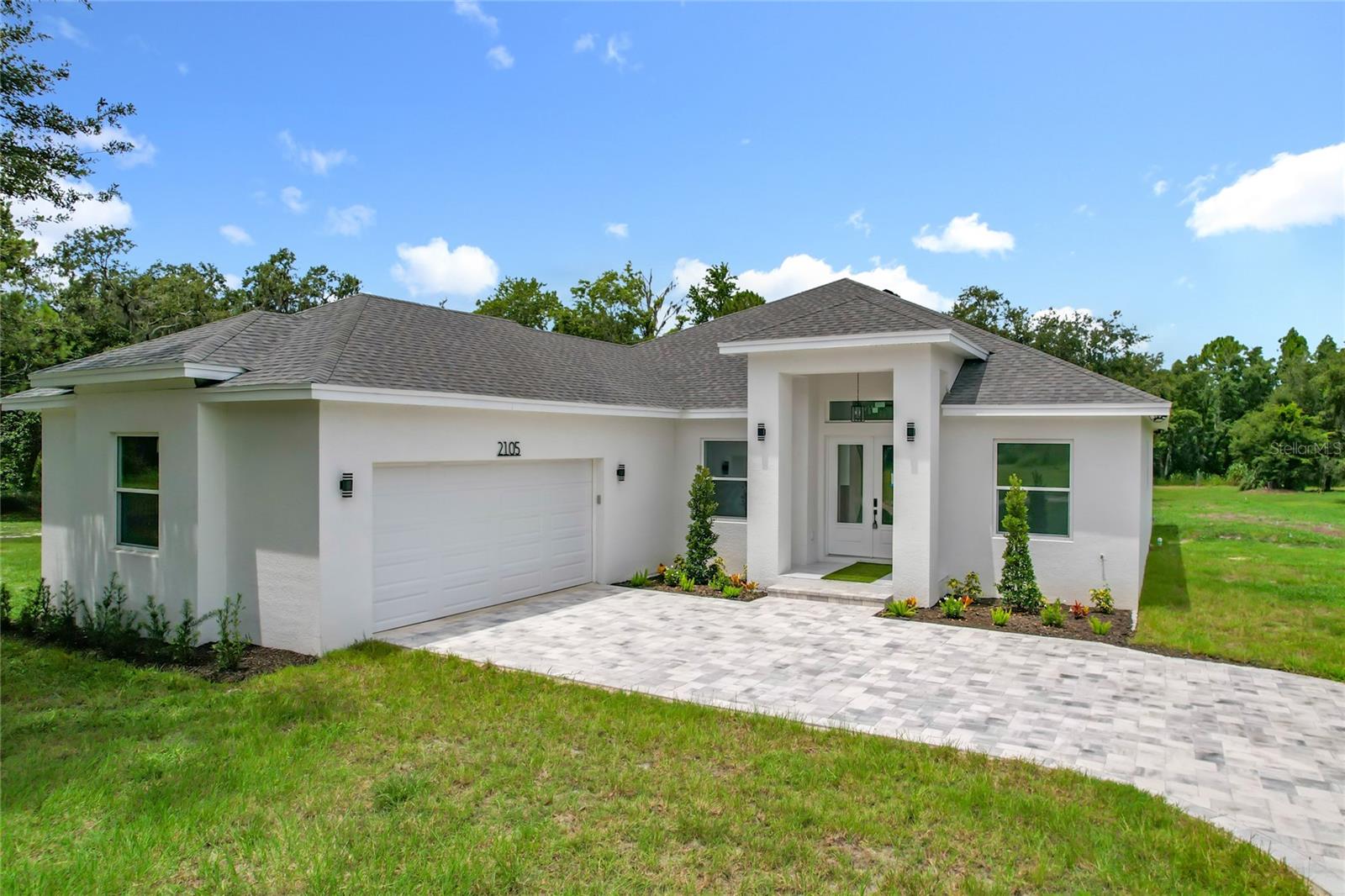 NO HOA, NO CDD, and 2 ACRES! Welcome to 2105 Dorman Rock Place in Plant City, Florida — a stunning new construction luxury home offering space, privacy, and convenience. This beautifully designed home features 4 bedrooms, 3 full bathrooms, a side-entry 2-car garage, a bonus room, private office, and formal dining room. From the moment you walk in, you’ll love the open floor plan, quartz countertops, wood cabinetry, walk-in pantry, and no carpet throughout the home.  SELLER WILL ASSIST IN CLOSING COSTS OR INTEREST RATE BUYDOWN!

The kitchen comes complete with all appliances included, and the home also features a tankless water heater for added efficiency. Enjoy Florida living from the covered lanai overlooking your spacious 2-acre homesite. With plenty of room for your RV, four-wheelers, campers, boats, trailers, and more, this property gives you the freedom to live the lifestyle you want. Conveniently located close to major highways,  while still offering the peaceful feel of country living. This is the perfect blend of luxury, land, and lifestyle — schedule your private showing today!