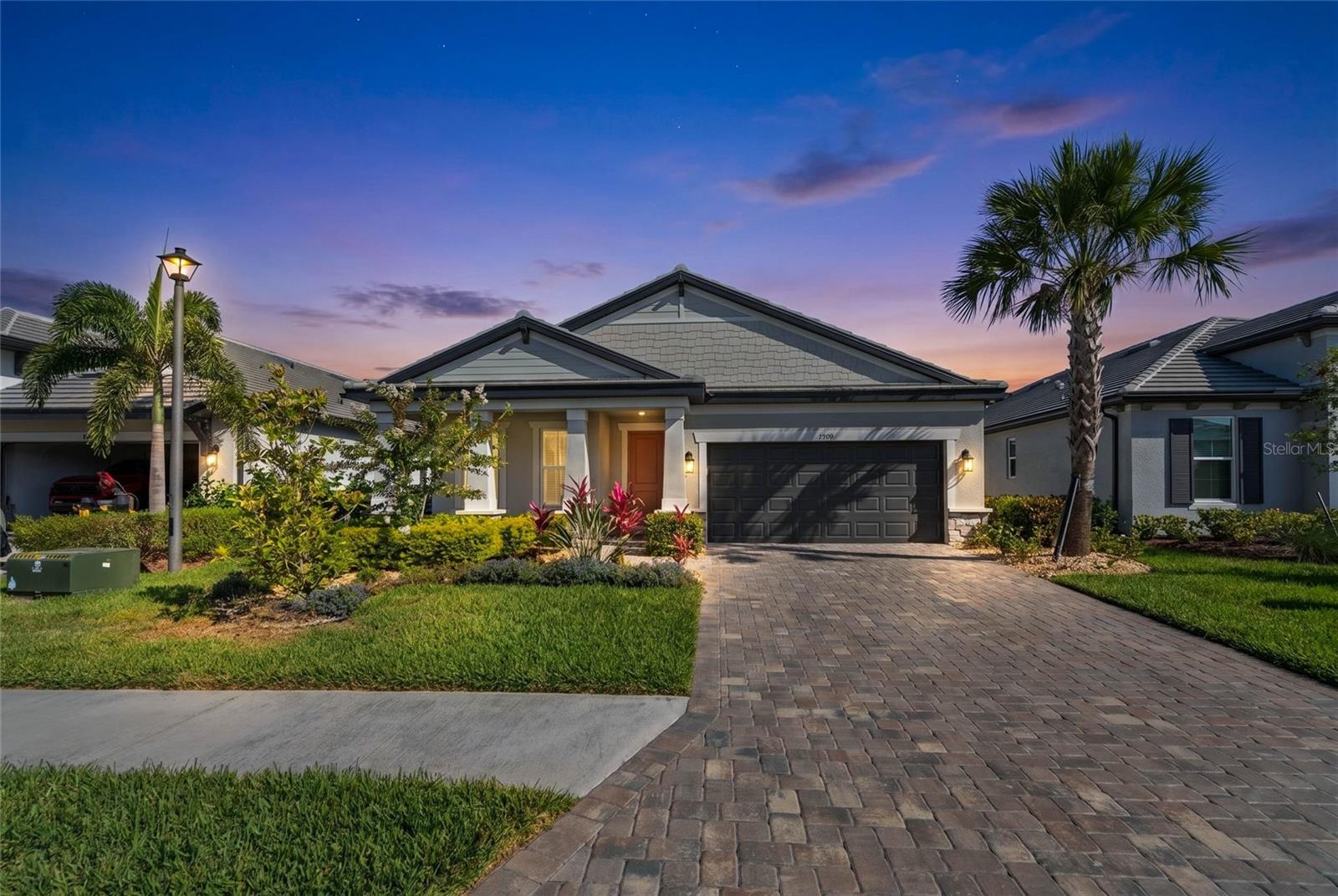 PRIVATE HEATED SALTWATER POOL, EXPANSIVE SCREENED LANAI, NEW LANDSCAPING, AND RESORT-STYLE SWEETWATER AMENITIES! Effortless indoor outdoor living and a private heated saltwater pool define this beautifully maintained 3 bedroom, 2 bathroom home in the highly sought after Sweetwater community of Lakewood Ranch. Designed with both comfort and style in mind, the open concept layout is filled with natural light and flows seamlessly into the expansive screened lanai, creating the perfect setting for relaxing or entertaining year round. The kitchen offers a clean, modern feel with a large island, stainless steel appliances, and ample cabinetry, all overlooking the main living space. The home is move-in ready with a washer, dryer, and refrigerator included, while recent upgrades such as all new landscaping with upgraded rock, stone, and lush plantings enhance both curb appeal and outdoor enjoyment. The screened pool enclosure adds an additional layer of privacy, allowing you to fully enjoy your backyard retreat. Sweetwater residents enjoy a resort-style lifestyle with amenities including a clubhouse, fitness center, pool, pickleball courts, playground, and scenic walking trails throughout the community. Ideally located near the UTC shopping and dining district, this home also offers convenient access to I-75 for easy travel while remaining just a short drive to Florida’s world-renowned Gulf beaches including Anna Maria Island and Siesta Key, making it the perfect combination of luxury, location, and everyday convenience.