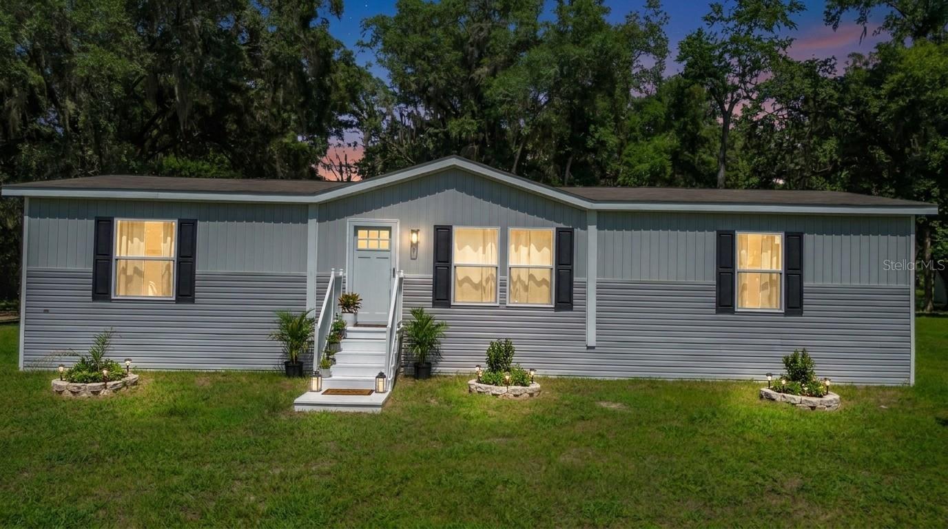 Welcome to your private slice of country paradise in Summerfield, Florida! This brand-new 2025 manufactured home offers 3 bedrooms, 2 bathrooms, and sits on an expansive 1.82-acre lot, providing the perfect combination of modern comfort, space, and future potential.

Never lived in and move-in ready, this home features a bright open floor plan, brand-new appliances, modern finishes, and plenty of room for family and entertaining. Enjoy the peace of rural living while still being conveniently located near shopping, dining, and major roadways.

What truly sets this property apart is its incredible versatility. The zoning allows for an additional tiny home or modular home, creating an excellent opportunity for multigenerational living, rental income, or a guest residence. The seller has already begun the process by constructing the framework for a second tiny home at the rear of the property. A septic system has already been installed for the future dwelling, giving the next owner a valuable head start toward completing the project.

Animal lovers will appreciate the flexible zoning that allows animals, making this property ideal for those seeking a mini-farm, homestead lifestyle, or simply extra room to enjoy the outdoors.

Whether you're looking for a primary residence, investment opportunity, or a property with room to grow, this unique Summerfield property offers endless possibilities. Schedule your private showing today and discover everything this exceptional property has to offer!