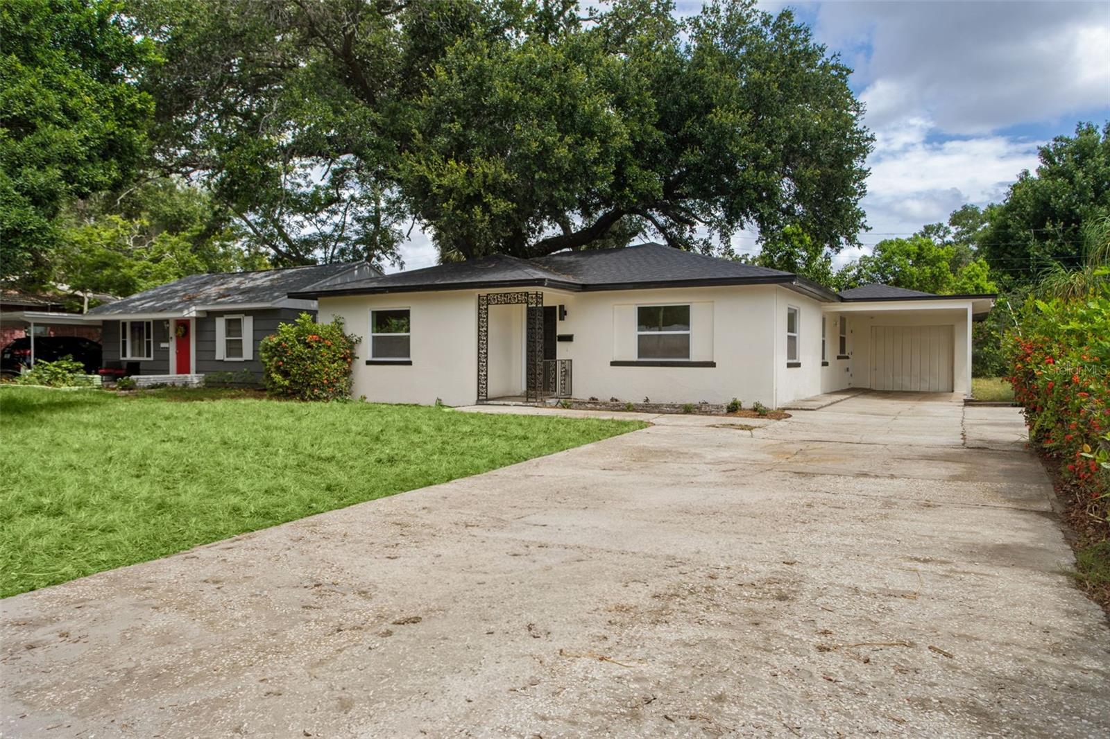 Look at this totally renovated home with a great location in South Saint Pete, near the park, the big lake, and not far from downtown. Move in knowing that in 2026 all the big ticket items have been taken care of, with a brand new roof, double pane insulated windows,new ductwork, and all new updated electrical system.  And the HVAC is only six years old. Inside enjoy the clean light feeling with a total renovation, including new luxury vinyl flooring, all new updated kitchen and appliances, and new modern bathrooms.  Spacious garage for extra storage, and the carport to keep you dry, and your car cool in the summer.  The backyard has enough room to customize and make it your own with maybe a big porch, outdoor kitchen and fire pit. The seller is a general contractor and can make additions, or upgrades after the sale if you desire.  Pictures have been virtually staged, to help the new buyer with planning.