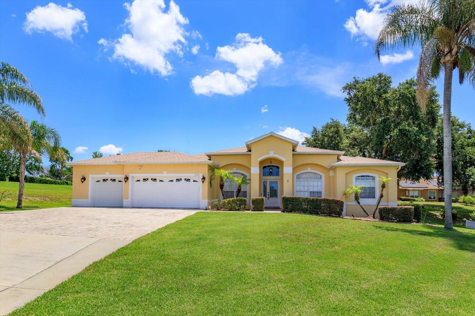 Move-In Ready Lake Minnehaha area home.  Welcome to this beautifully maintained 4-bedroom 3-bathroom home located off Anderson Hill, overlooking are Minnehaha.  Combining comfort, functionality, and an exceptional location this property is approximately  25 miess from Central Florida's renowned theme parks while offering the tranquility of lakeside living, It is conveniently located near major roads, highways, shopping, restaurants and nearby schools and hospitals.  The home features numerous upgrades, including an added third-car garage, oversized paver driveway, and an extended lanai spanning the entire length of the home, which creating the perfect space for outdoor entertaining and relaxation,  Inside, you'll find a thoughtfully designed floor plan with quality finishes throughout, including Silestone countertops, 42-inch maple cabinetry, stainless steel appliances.  Built-in coffee bar/brekfast nook.  Birchwood and tile flooring throughout.    One bedroom featuring a custom built-in desk with file cabinet- ideal for a home office study, or hobby space.  Recent updates provide added peace of mind:  New roof (2024) new electric water heater (2025) new A/C system installed (2020), serviced May 22026.  New irrigation meter and timer (2025).  With no HOA or CDD fees, beautiful lake-area surroundings, and major system updates already completed, this move-in-ready home offers exceptional value-in one of the area's most desirable locations.  Schedule your private showing today and explore all the possibilities this home provides.
