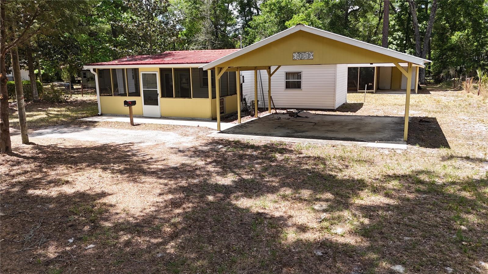 Located in the heart of Chiefland, this 2 bedroom, 1 bath home sits on a spacious .46-acre lot and offers plenty of potential for the right buyer. The property is fully fenced and features a screened-in front porch, perfect for enjoying peaceful mornings and relaxing evenings. A covered carport provides convenient parking, while the detached screened room with attached storage and additional shed offer extra space for hobbies, tools, or outdoor equipment. The home does need some TLC, making it a great opportunity for investors, first-time buyers, or anyone looking to add their personal touch. Conveniently located near local shopping, restaurants, schools, and medical facilities, this property also offers easy access to some of North Florida’s best outdoor recreation. Enjoy nearby natural springs, the Suwannee River, and the Gulf Coast for boating, fishing, and kayaking adventures. With its great location and large lot, this property has endless possibilities.