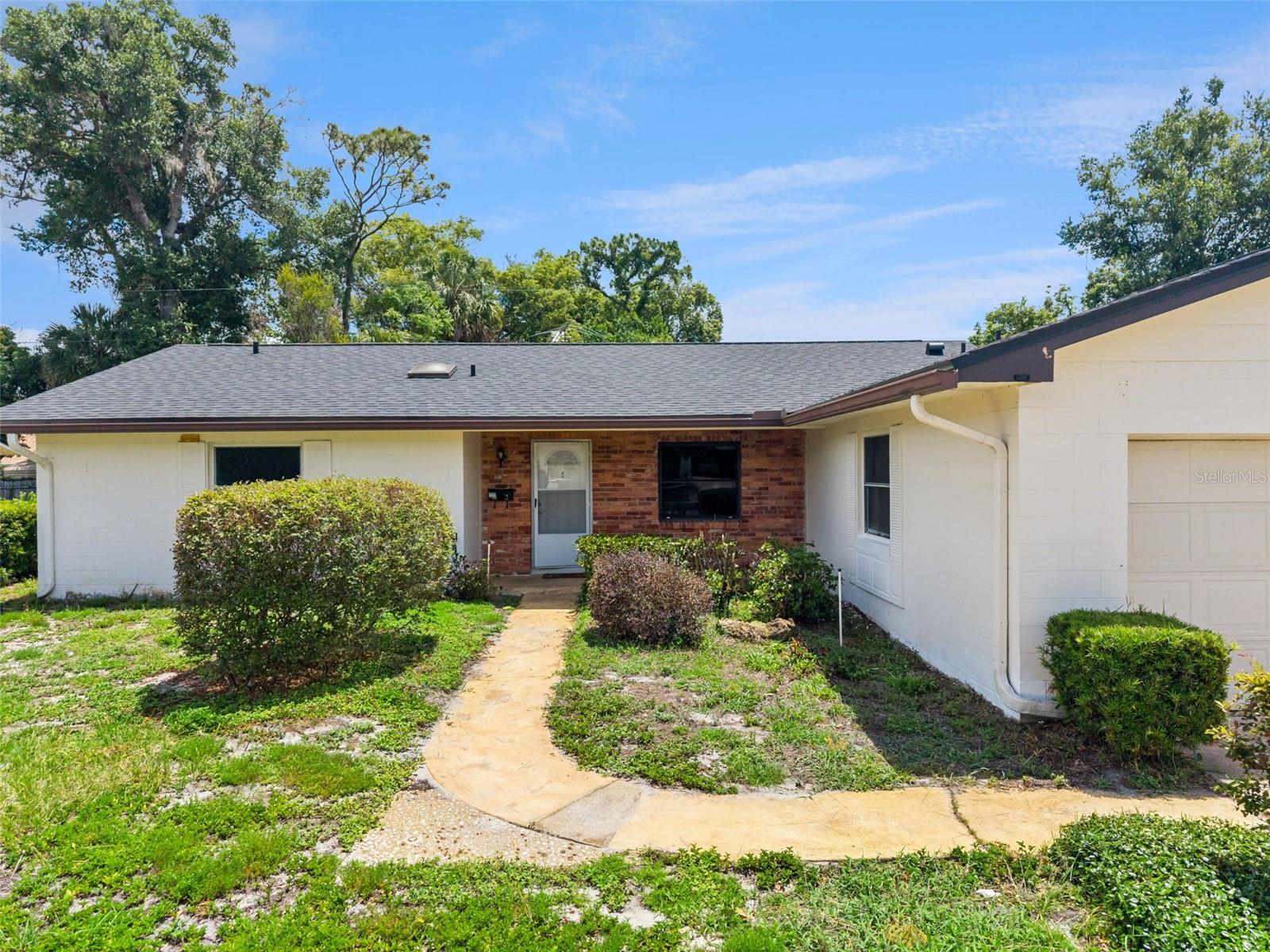 Welcome to this beautifully maintained 4-bedroom, 2.5-bath home located in highly desirable Seminole County! From the moment you arrive, you'll appreciate the inviting front porch, the perfect place to relax, enjoy conversations with friends, and greet neighbors passing by.

Inside, the home features recently painted interiors and new laminate flooring in the bedrooms, creating a fresh and move-in-ready feel. Pride of ownership shines throughout, as this home has been lovingly cared for over the years.

Step outside and enjoy the spacious, landscaped backyard complete with a private irrigation well, screened-in porch ideal for morning coffee or evening unwinding, and a charming brick fire pit perfect for cooler Florida nights. There's even an outdoor shower, a unique and convenient touch after gardening or enjoying time outside on warm summer days.