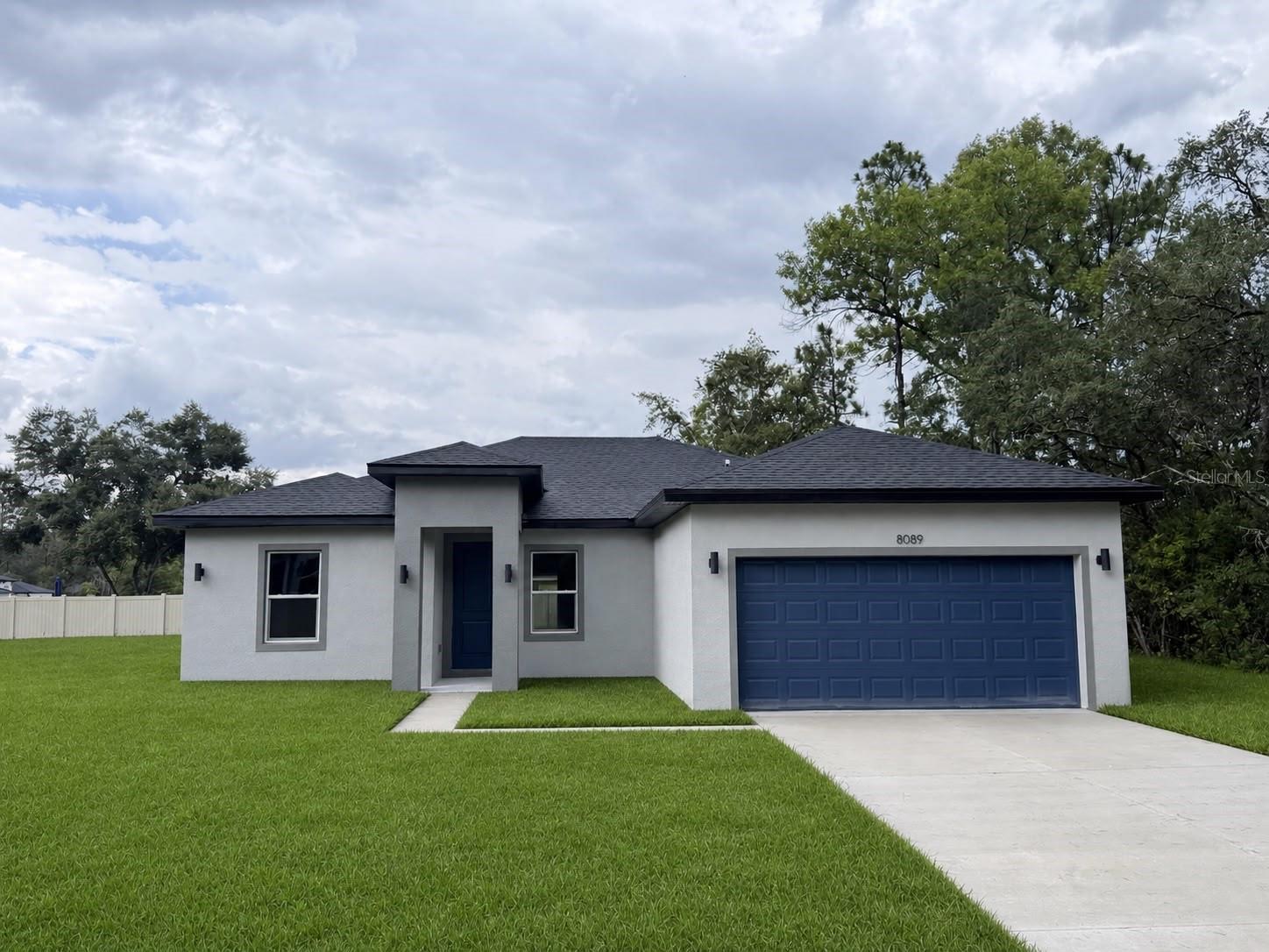 Brand-New Home on a Premium Oversized Corner Lot in Dunnellon

Welcome to this stunning new construction home in the growing community of Dunnellon, offering the perfect combination of modern design, comfort, and functionality. Situated on a premium oversized corner lot, this beautiful property provides extra space, enhanced curb appeal, and added privacy, making it an exceptional opportunity for homeowners seeking both style and value.

Inside, you'll find a thoughtfully designed open-concept floor plan that seamlessly connects the spacious living and dining areas, creating the ideal setting for everyday living and entertaining. Large windows fill the home with natural light, enhancing the bright and inviting atmosphere throughout.

The well-appointed kitchen is designed to impress, featuring solid wood cabinetry, elegant stone countertops, and a full appliance package included with the home. Whether you're preparing family meals or hosting guests, this space offers both beauty and functionality.

This home features four generously sized bedrooms, including a spacious primary suite with a walk-in closet and a private full bathroom. The additional bedrooms have built-in closets and plenty of space for family members, guests, or a home office. Two full bathrooms provide convenience and comfort for the entire household.

Additional highlights include a two-car attached garage, quality craftsmanship throughout, and the peace of mind that comes with owning a brand-new home.

Conveniently located near major roadways, shopping, dining, and highly rated schools, this property has easy access to everything Dunnellon has to provide while maintaining the charm of a peaceful residential setting.

Don't miss the opportunity to own this exceptional new construction home on a premium oversized corner lot. Schedule your private showing today and discover everything this beautiful property has to provide.