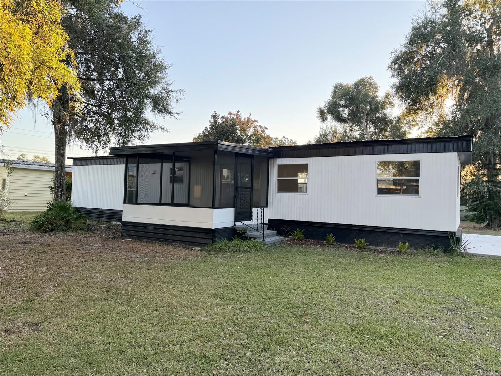 BEST DEAL you will find in The highly desirable Continental Country Club active 55+ Community. Home qualifies for conventional financing or FHA. This beautifully renovated 2-bedroom, 1.5 bath home offers comfort, functionality, and incredible value. Located on owned land, it includes a screened raised porch with sliding doors that open into the living area, plus a utility building with washer/dryer hookups. Recent upgrades include a new A/C system, upgraded electrical and plumbing, brand-new appliances, and a brand-new washer and dryer—providing peace of mind and modern convenience from day one. The community is one of the area’s most sought after 55+ destinations, offering a resort-style lifestyle at an affordable price. Residents enjoy access to a heated swimming pool, hot tub, a spacious clubhouse, fitness center tennis and basketball courts, community library, an on-site restaurant/bar, community activities, a golf pro shop, plus owner discounts at their impressive 18-hole championship golf course. The course is beautifully maintained—so popular that even residents from The Villages and surrounding areas come here to play. Golf carts are available for rent, and many residents enjoy the convenience of owning their own, making it easy to explore the community. The HOA includes cable, high speed internet, Wifi, basic lawn mowing/edging, trash pick up and free basic golf cart maintenance. This community truly offers incredible value. You get a lot for your money here at The Continental Club. It's a must see in person to fully appreciate everything it offers. This gated community with 24-hour security provides both safety and a vibrant social environment. From indoor and outdoor activities to arts, crafts, and organized events, there’s always something happening. It truly feels like living in a golf-course resort without the high price tag. Conveniently located close to shopping, dining, and medical facilities, this home offers year-round enjoyment and an exceptional community lifestyle. A must-see to fully appreciate everything it has to offer. Listing agent is related to the seller and has an ownership interest in the property.
