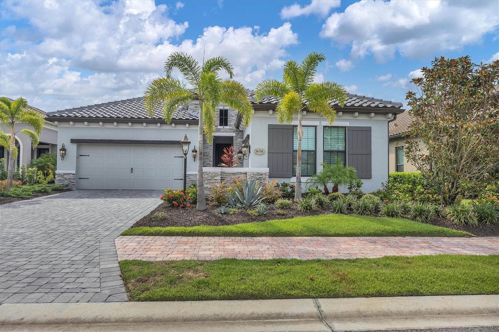 Move right in and start living your best life in this beautifully maintained single-family residence located in the highly sought-after community of Country Club East in the heart of Lakewood Ranch. This Carolotta model with an extended lanai was masterfully built by Neal Signature Homes, and perfectly positioned on the lot to deliver tranquil, private preserve views. Neutral finishes, an open floor plan, high coffered and tray ceilings, crown molding, large banks of windows and doors, plantation shutters and abundant natural light are just some of the features that make this home special. The kitchen is a dream and is completely open to the adjacent great room and dining room and features stunning white cabinetry, quartz countertops, tile backsplash, stainless steel appliances, a walk-in pantry and an enormous rectangular island with counter-height seating. The great room opens to the extended lanai that boasts a heated saltwater pool and spa, a paver deck, covered and uncovered seating areas, a fireplace and a custom summer kitchen. For a more intimate gathering or to relax at the end of the day, the bonus room is the perfect spot to unwind with a good movie or sporting event. The owner’s suite features motorized blackout shades, a custom-organized walk-in closet, a large shower with multiple shower heads, dual vanities, and a water closet. There are two additional bedrooms that share a bathroom, powder room accessible from the lanai, a large laundry room, a two-car garage and a separate one-car garage. Smart home features include Bose sound system, Ring and Clare security systems and remote-control pool operation. There is an array of amenities in Country Club East, such as spinning, a gym with state-of-the-art exercise equipment, tennis, pickleball, a basketball court and community pools that are all included in the Homeowners Association Fees. Enjoy being so close to The Mall at University Town Center, dining and the three private golf courses, along with the Legacy Golf Club public course. Furniture and electronics are available in a separate package.