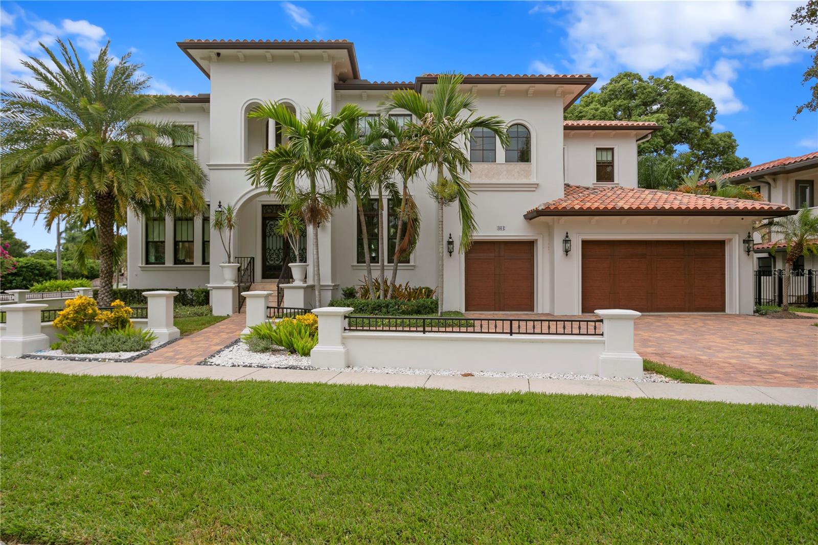 NEW REDUCED PRICE, Come enjoy the highly desirable Davis Islands lifestyle. Must see this modern take on a gorgeous Davis Islands Mediterranean waterfront! Live “the lsland” lifestyle. A boater’s paradise with access to Tampa Bay, great for cruising and fishing. Golf cart community. Fabulous indoor and outdoor spaces to enjoy and share with loved ones. Six bedrooms, six and a half bathrooms, over 6,500 heated square feet and over 8,600 total square feet. Spacious three-car garage. Sits on a corner lot, deep water canal, with partial open bay views, just a few houses from Hillsborough Bay. Designed for privacy, waterfront views and access. Large dock and boat lift with electric/water connections. Beckoning heated, salt-water pool with waterfall feature and a spa. Turf backyard for low maintenance play area. Huge covered patio features outdoor kitchen/bar, gas fireplace and multiple seating areas. Great outdoor entreating space for the family.  Complete Smart Home system. Stunningly beautiful and spacious kitchen, breakfast nook and family room are flooded in natural light and open to the covered patio. Gourmet kitchen features Calcutta marble countertops and backsplash; pot-filler; Thermador appliances including refrigerator/freezer, two dishwashers, six-burner gas cooktop/grill with double oven, convection oven, microwave and warming drawer. Substantial walk-in pantry. Butler’s pantry and custom wine room. Formal living room and formal dining room (or a great spot for a pool table). First floor guest suite can be used as a second master; also makes an attractive office/den with full, pool bath. Laundry/mudroom on the first floor and another laundry room conveniently located upstairs. Super-sized master suite, with beverage fridge, wet-bar, an ultra-luxurious bathroom and three extra large walk-in closets. Spoil yourself on its private, covered balcony with breathtaking water and sunset views! Four other bedroom ensuites. A large loft/bonus room to relax and unwind. Fine architectural features and thoughtfully laid out floor plan. All block construction. Impact windows. Top-notch schools, including Plant High School. A truly special community with a small-town feel, yet minutes to downtown’s Riverwalk, Amalie Arena, Hyde Park Village and Bayshore Blvd. Davis Islands itself offers a village of restaurants, bars and shops; along with clay tennis courts, swimming pool, marina, yacht club, public boat ramps, small airport, two dog parks, Little League facilities, playground, parks/trails, a beach and Tampa General Hospital. No wonder golf carts are a favorite mode of transportation on “the island”! Schedule your tour now.