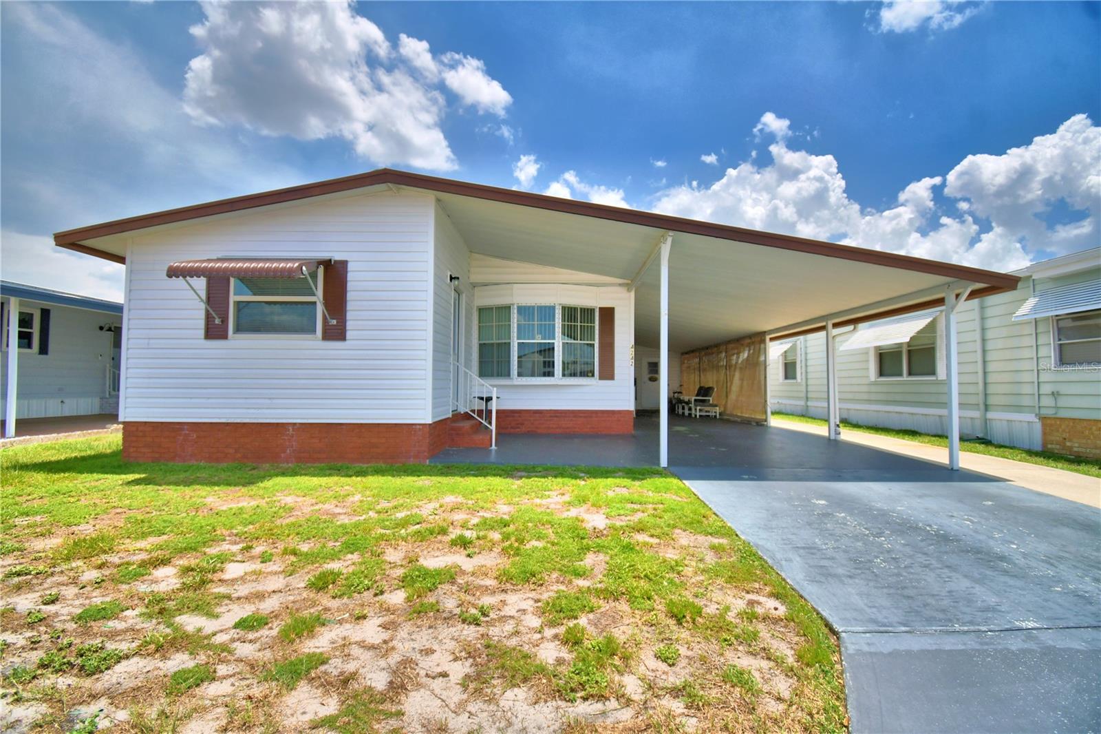 Pack your bags and move right into this fully furnished home.  You won't find any carpet in this well maintained home with new vinyl plank flooring in the living room, dining room, and kitchen.  The refrigerator, dishwasher, and washer and dryer have been updated in the last few years.  Sit on the bright and inviting front porch with your morning coffee.  Oakwood Estates, a 55+ community offers many activities and amenities including 2 pools, 2 clubhouses, shuffleboard, tennis courts, miniature golf and bocci ball.  Make your appointment to see this lovely home today!!
