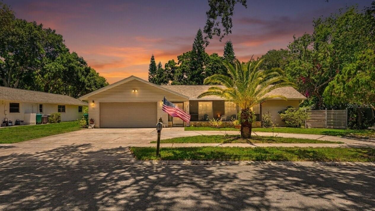 Welcome to Westlake Village, one of Palm Harbor's most sought-after communities. Offering over 2,000 square feet of living space, an oversized saltwater pool and spa, and an expansive screened lanai designed for entertaining, this 4-bedroom, 2-bath home captures the Florida lifestyle buyers are looking for.

Inside you'll find generously sized rooms, soaring vaulted ceilings in the living room, and multiple living areas that provide flexibility for both everyday living and entertaining. The spacious family room offers an inviting place to relax or gather with friends and family, while the thoughtfully designed split-bedroom floor plan provides comfort and privacy. The primary suite is privately situated away from the secondary bedrooms, and the second bathroom conveniently serves as a pool bath with direct access to the outdoor living area.

The backyard is the true centerpiece of this home. An impressive oversized saltwater pool and spa, recently refinished with a premium exposed aggregate finish that creates a stunning brilliant blue water color, is complemented by an expansive screened lanai offering exceptional space for lounging, outdoor dining, and entertaining. Brand-new pool equipment and a new Hayward gas heater provide peace of mind, making this backyard retreat completely turnkey and ready to enjoy year-round.

Additional updates include a newer roof (2024) and brand-new kitchen appliances, providing added value and peace of mind for the next owner.

Located in one of Palm Harbor's most desirable communities, Westlake Village offers low HOA fees and exceptional amenities, including a clubhouse, community pool, tennis courts, parks, and playgrounds. Conveniently situated near top-rated schools, shopping, dining, Gulf beaches, and everything Palm Harbor has to offer.