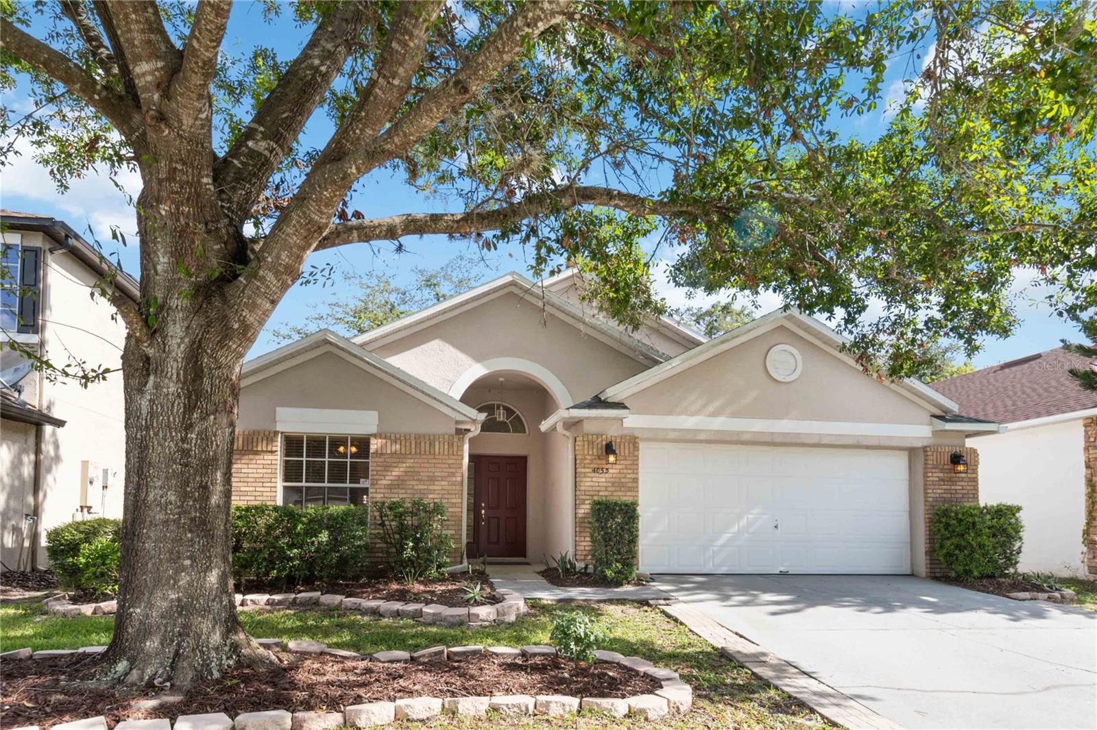 SELLER PAYS $4,000.00 OF BUYER'S CONCESSIONS WITH FULL PRICED OFFER! You know what they say...LOCATION, LOCATION, LOCATION! This your opportunity to own your own home and start making memories right behind UCF in the popular community of Tanner Crossings. The split floor plan offers soaring ceilings, making the home appear larger than it is, and plenty of windows provide natural lighting throughout. Upon entering the home there is a bedroom to the left, that could also be utilized as an office, perfect for remote working from home. A spacious area includes your formal dining and living rooms, with two other bedrooms down the hallway that share a bathroom. Passing the formal areas, you come to the kitchen, and the kitchen nook, which overlook the family room, and an entrance to the master bedroom. The kitchen offers plenty of eating space for family dinners in the nook area or you can grab a quick bite to eat at the snack bar for morning breakfast. The kitchen remodel offers a beautiful modern look with white cabinetry with soft close features, stainless steel hardware, and pretty granite countertops complete with a new sink and faucet. The entire home has large porcelain tile flooring throughout, which makes it great for those with allergies, or easy peasy cleaning with kiddos and pets. This is such a fun floor plan where you can add to the decorator shelves with any decor you like. The master bath offers both a separate shower plus a garden bath tub for those who love to relax after a long day at work. The rear of the home has large sliding doors  leading to an open patio and spacious yard offering a nice spot to have your morning coffee, or enjoy relaxing moments outdoors in the yard.  Seller improvements include: ROOF AND ROOF VENTS 2018, AC REPLACED 7/25/2023, , BATHROOM AND KITCHEN SINKS AND FAUCETS 2023, FAUX WOOD BLINDS THROUGHOUT 2009, KITCHEN REMODEL INCLUDED NEW WHITE CABINETS, HARDWARE, GRANITE COUNTERTOPS, STAINLESS STEEL MICROWAVE AND RANGE 2023, there is NEW INTERIOR PAINT IN THE ENTIRE HOME AND IN GARAGE, PLUS GARAGE FLOOR 2023, PORCELAIN TILES THROUGHOUT ENTIRE HOME 2016, WATER HEATER 2020, BATHROOMS NEW GRANITE COUNTERTOPS AND RESURFACING OF TUBS plus new landscaping mulch. Tanner Crossings has a wonderful community pool and playground for you to enjoy all year round. The pool is conveniently located right across from the home and the community is currently installing a new pergola for you to enjoy! This fabulous location is close to major highways, retail shopping, restaurants, schools, UCF, Seminole State College, elementary, middle and high schools and so much more! The Econ River Wilderness Area is minutes away for the nature enthusiasts who enjoy walking trails or taking furry friends for a walk. Popular Florida beaches are just 45 minutes to an hour away. Downtown Orlando, and popular theme parks are a short drive away too.  The housing inventory is still super low, don't wait or it may be too late with over 1,000 people moving here a day! I'm just a phone call away to schedule your own private viewing.
