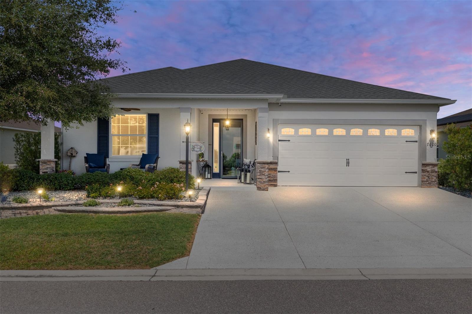Truly move-in ready! This beautifully upgraded Ginger model sits in the gated golf cart community of Weybourne Landing at On Top of the World. The 2-bedroom, 2-bath layout features a versatile flex room with French doors, an extra-wide epoxy driveway, and a 2-car garage. The gourmet kitchen is the heart of the home, with an extra-long granite island, staggered soft-close cabinetry, Italian marble backsplash, upgraded stainless appliances including a convection/microwave wall oven, and a 5-burner gas cooktop. The primary suite offers plush carpeting, a large walk-in closet, and a spa-inspired bath with dual vanities, quartz counters, and a zero-entry tiled shower.
Outside, enjoy a private Floridian retreat: a screened birdcage with a 6-person hot tub, covered lanai, expanded paver patio with pergola, and a granite grill station with seating for 8 — all framed by privacy fencing and lush landscaping. Additional upgrades include a water softener, smart-home features, Ring security, and a golf cart charging outlet.    Residents enjoy Weybourne's resort-style pool, clubhouse, fitness center, and pickleball courts, plus golf cart access to On Top of the World's golf courses, dining, ice cream and coffee shops, and Circle Square Commons. Impeccably maintained and move-in ready — luxury and resort-style living at an outstanding value!