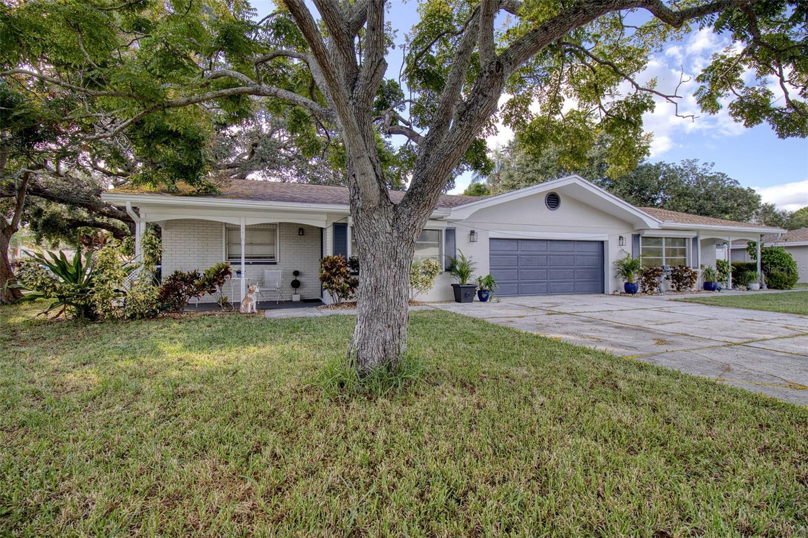SELLER MOTIVATED.  SELLER OFFERING $10,000 AT CLOSING WITH AN ACCEPTED OFFER BY 31 DECEMBER, 2023. Wow! Location, Location, Location! This is an amazing opportunity to own this delightful block construction DUPLEX in beautiful Dunedin close to Downtown and Pinellas Trail on a large corner lot.  There is the potential to convert the garage to a 1 bed, 1 bath 550 sq ft apartment with a loft under the main roof as this property's zoning includes TRIPLEX. With 2130 sq ft of current living space, pool, solid block and brick construction and 2 bedrooms in both units, this is a very desirable property to either rent both sides or live in one and rent the other side. This would also be an excellent set up as an in-law apartment. 1410 Gladys is over 1000 sq ft of living with 2 beds and 1 bath and has a delightful screened back patio and a fenced yard. It also has its own laundry room! 1412 Gladys features 2 beds and 2 baths. There is a slider from the master to the refreshing pool in the fully fenced private backyard. There is an exterior entrance into the 2nd bedroom which is great in a shared rental situation. This spacious duplex also has a laundry room, an oversized 2 car garage with a loft and additional storage. The garage is air conditioned and is currently used as a bonus room. This garage space has so much potential to add extra 550+ sq ft as a 1/1 apartment. The duplex exterior was painted 2023 in neutral grey tones. The roof is 2016, pool 2004, and one a/c 2023. The other a/c has new major components. The hot water heaters are both newer. Both units have their own electric meters and there is the possibility to also separate the water bill. The large corner lot provides additional parking for up to 6 cars on the oversized driveway. The location is also amazing! It is in close proximity to Downtown Dunedin, NOT in a flood zone, in a golf cart neighborhood, close to the trail, parks, shops and restaurants, great schools and all that delightful Dunedin has to offer. Jump in your golf cart and head downtown for dinner, a festival or to have drinks with friends at the many breweries, coffee shops and wine bars.