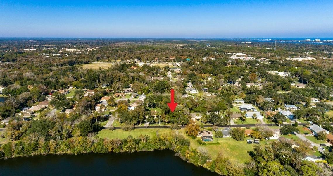 Rare Park-Front Paradise in the Heart of Ormond Beach! Discover a once-in-a-lifetime opportunity to build your custom dream home directly across from the iconic Central Park. This prime half-acre lot offers an unparalleled 'backyard' experience, with 149 acres of lush landscapes, fishing lakes, kayaking, and miles of scenic trails right at your doorstep. Enjoy the perfect blend of tranquility and convenience, located just minutes from Ormond's pristine beaches, boutique shopping, and fine dining. With water, sewer, and electric already accessible and a survey on file, this rare gem is ready for your vision.