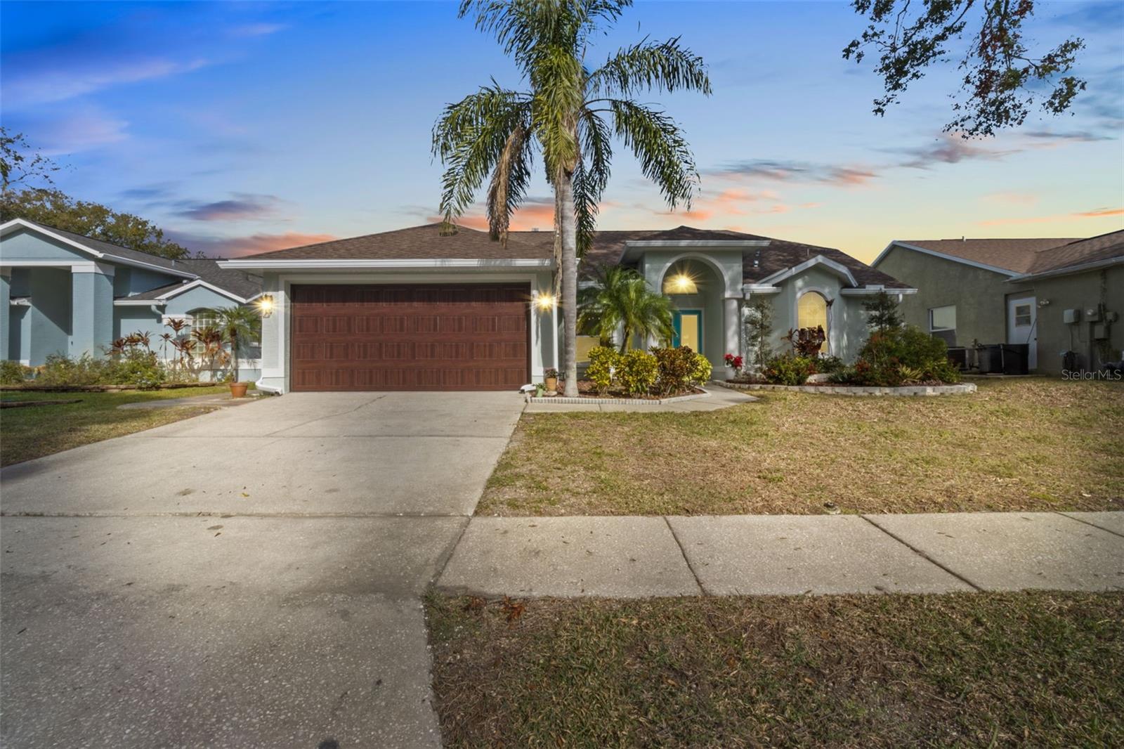 Amazing opportunity to own a beautifully updated 3-bedroom, 2-bath, 2-car garage home built in 1994 and tucked away at the end of a cul-de-sac, just 1.4 miles from the world-famous Tarpon Springs Sponge Docks, Sunset Beach and Fred Howard Park just 2 miles. Easy access to Palm Harbor, Clearwater, Safety Harbor and Tampa from US Hwy 19. Enjoy the convenience of nearby restaurants, shops, and everyday amenities while still feeling secluded and private.

Situated on a nice deep 69x100 lot with low HOA fees of approximately $250 per year, this home offers a desirable setting with plenty of outdoor space to enjoy.

This solid, split-floor-plan home features cathedral ceilings in the living room and primary bedroom, creating an open and spacious feel. Sliding glass doors in the living room open fully to the exterior, offering the perfect indoor/outdoor flow for entertaining, barbecuing and outdoor living, with ceiling fans under the actual roof covering, great patio area.

High and dry in a NO FLOOD ZONE with no damage from the 2024 storms. Major updates include a newer roof, newer hurricane-rated windows, a new custom hurricane-rated garage door, newer 2024 central air and heat system with UV lights, advanced filtration, dehumidifier, and smart thermostat, plus a new whole-home soft water system with charcoal filtration 2024.

The exterior has been thoughtfully upgraded with new 6-inch roof gutters around the entire perimeter of the home, new backyard landscaping, new high-end pavers, a custom retaining knee wall, and a covered open-roof patio area ideal for relaxing or entertaining. As part of the custom paver project, the home also features a custom drainage system around the backyard pavers, designed to direct water from the gutter downspouts out toward the front yard. The home also includes a state-of-the-art WiFi-controlled Hydrawise sprinkler system on well water.

Additional updates include new washer and dryer, new garbage disposal, new white carpet in two bedrooms, new exterior paint, newer flooring, stainless steel kitchen appliances, and newer countertops. Home may be sold furnished or unfurnished.

Move-in ready and full of upgrades, this Tarpon Springs gem offers comfort, convenience, and peace of mind in a highly desirable location. Don’t miss this one!