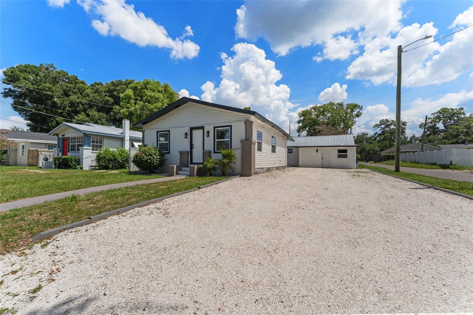 Modern Bungalow with detached ADU + private entry! *10% CAP RATE POTENTIAL!* Main home is a 3/1 (963sf) and ADU is 1/1 (359sf). Main home roof 2023, ADU roof 2025. HVAC 2024. Luxury vinyl flooring throughout both units - no carpet. Main home features well-designed kitchen with modern finishes, high-end stainless-steel appliances that include a 5-door KitchenAid refrigerator, LG cooktop, and LG dishwasher. The island countertop, highlighted by acoustic wood accents, is complemented by elegant LED backlit wine rack. The upgraded spa-like bathroom, adjacent to the primary bedroom, offers a rainfall shower with a glass enclosure and stunning standalone tub. High quality window shades provide complete privacy and boost energy efficiency by keeping space cooler in summer months. Two additional guest bedrooms located towards the front of the home, great for those with home office needs or multiple tenants. Inviting bonus room foyer serves as a cozy reading nook, alternative office space, or mudroom. Outside, enjoy grilling on the back deck and benefit from an oversized driveway that accommodates 5-6 vehicles. In the neighborhood you will find top dining and nightlife spots like the Michelin-recognized Rooster and Till, Mekenita Cantina, Bo’s Ice Cream, Bamboozle, and The C House - all a short drive away. Enjoy craft cocktails at Mandarin Heights or kick off your day with a coffee from The Lab. Perfect location for anyone that loves to explore Tampa’s vibrant restaurant scene. Other nearby attractions include Lowry Park Zoo, Busch Gardens, and Rogers Park Golf Course. Excellent for commuters with highway access only a minute or two away. Income-producing, upgraded in every corner you look, what are you waiting for! Book your showing today.