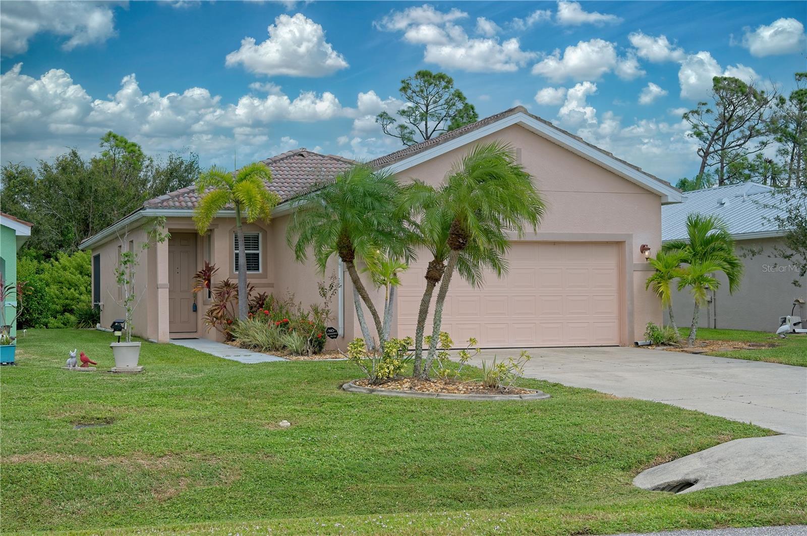 Stunning 3 Bedroom, 2 Bathroom Villa with an attached 2 Car Garage, nestled in the highly sought-after KINGS ISLAND community within the picturesque Lake Suzy area. Originally built in 2005, this home received a comprehensive makeover in 2015, ensuring it embodies modern comfort and style. Updates include a NEW A/C unit in November 2017, a NEW Hot Water Heater in 2015, and brand NEW tile floors throughout the property in 2015. Additionally, the kitchen features wood cabinets and exquisite granite countertops, both added in 2015.

This meticulously cared-for Villa showcases a welcoming open-concept layout with a Great Room that boasts 9-foot ceilings. The kitchen is a culinary enthusiast's dream, complete with a dining area, a breakfast bar, and a pantry closet. Enjoy the tranquility of the outdoors from the comfort of your screened lanai, featuring a stylish tile floor. The convenience of an Inside Laundry room further enhances the functionality of this home. The Master Bedroom suite pampers you with a spacious walk-in closet and a private bathroom equipped with a walk-in shower, dual sinks, a vanity, wood cabinets, and gleaming granite counters. Two generously sized guest bedrooms provide comfortable accommodations, and the guest bathroom boasts a wood vanity, granite countertop, and a tub/shower combo.

For those interested in furnishings, the good news is that they are negotiable, allowing you to move right in and make this space your own. Enjoy the serene view of Florida's native trees from the privacy of your villa. Additional features of this property include a durable tile roof, hurricane shutters for added protection, pre-wiring for an alarm system, a convenient pull-down attic with a plywood floor in the garage, and tile flooring throughout the entire villa. The guest bedrooms also feature spacious double closets.

The HOA fee encompasses essential services such as lawn irrigation and comprehensive lawn care, which includes mowing, pest control, and weed control, ensuring a hassle-free living experience. Located just minutes away from golf courses, shopping centers, dining options, and the convenience of I-75, this home provides easy access to entertainment. It's also a short drive to medical facilities and the charming historic downtown of Punta Gorda, with Gulf beaches within convenient reach. Upgrade your lifestyle and make this modern villa your new sanctuary today!