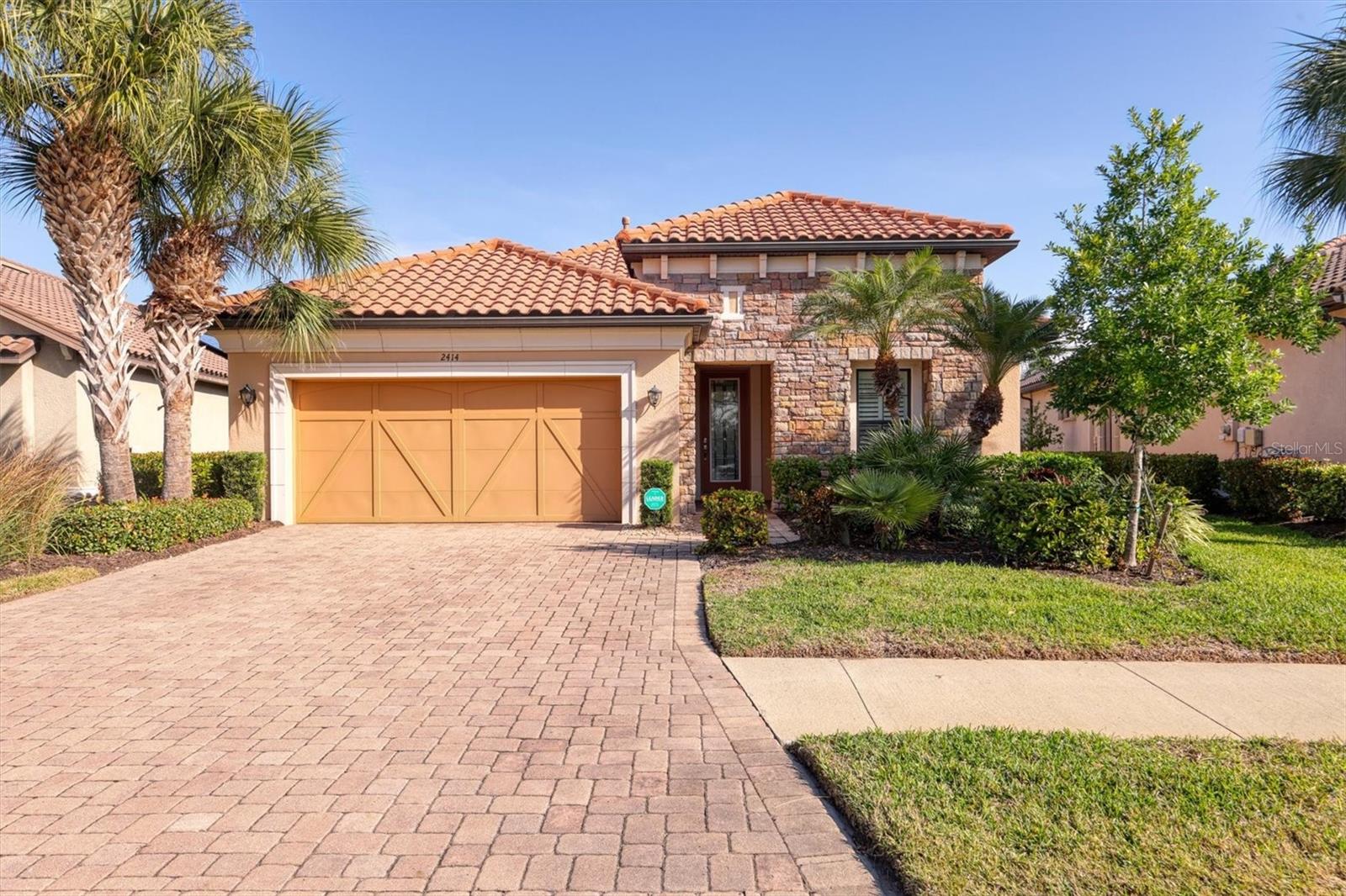 NEW PRICE Best Value in the Neighborhood. Motivated sellers bring all offers. Live the Florida lifestyle. Located behind the gates of the sought-after Esplanade by Siesta Key, a beautifully appointed 3-bedroom, 3-bath residence with den and extended lanai, showcasing the highly desirable Lazio VII floor plan with tranquil water views.
Curb appeal is enhanced by a striking stone façade, an expansive paver driveway, and lush landscaping supported by an automated sprinkler system with reclaimed water—along with ground maintenance, all included in the HOA. Step inside to discover an open-concept design ideal for both entertaining and everyday living, highlighted by new luxury vinyl flooring throughout main living area.
The casual yet elegant kitchen is the heart of the home, featuring upgraded cabinetry with hidden hinges, decorative dentil molding, soft-close sliding drawers, granite countertops, a large gathering island, stainless steel appliances, double ovens, and a natural gas cooktop.
This home offers three newly updated bathrooms, thoughtfully designed for modern living with high-end finishes and outstanding features. Additional upgrades include Low-E double-pane windows for energy efficiency, hurricane shutters, and Kevlar hurricane panels for the lanai and front door, providing peace of mind and easy storm preparedness.
Recent improvements include new exterior waterproof paint, a new A/C system with UV light, a whole-house carbon water filtration system, and a reverse osmosis system under the kitchen sink. Elegant architectural details abound, including tray ceilings, tall interior doors, plantation shutters, and crown molding.
The spacious primary suite features an oversized walk-in closet with custom built-in cabinetry.Perfectly situated just minutes from premier shopping, dining, and world-class entertainment—and only a short drive to the powdery sands of Siesta Key Beach—this meticulously maintained home offers luxury, comfort, and location in one remarkable package