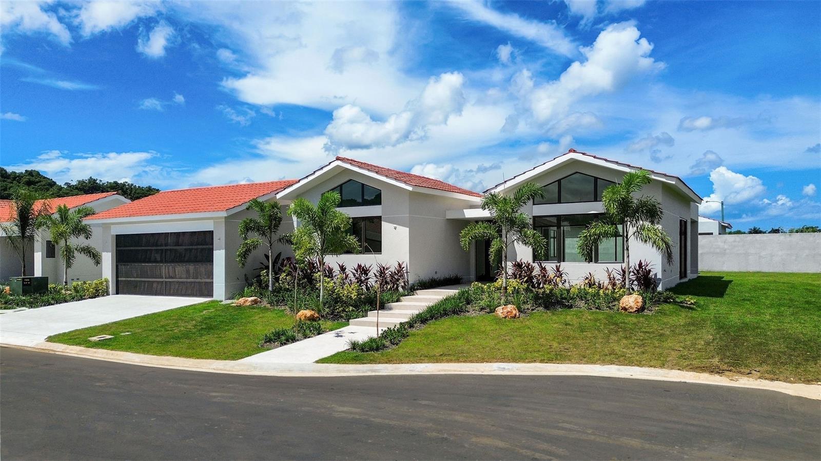 Located within the exclusive Isla de las Flores enclave at Sabanera Dorado, this newly completed Casona del Lago residence offers a rare opportunity to own a brand-new home on one of the community’s desirable cul-de-sac lots. Situated on an expansive 11,256 sq ft lot with direct access to green areas, the property combines privacy, open surroundings, and the lifestyle that has made Sabanera one of Puerto Rico’s most sought-after communities.

Completed in 2025, the residence has never been occupied and remains under the developer’s warranty. Its thoughtfully designed single-level floor plan offers 4,092 square feet, creating a seamless flow between indoor and outdoor living areas.

Property Features:
• 4 Bedrooms | 4.5 Bathrooms (convertible to a 5-bedroom layout)
• Spacious primary suite with walk-in closet and ensuite bathroom
• Private studio/home office
• Open-concept kitchen with pantry
• Dining area and family room
• Covered gallery and terrace
• Two-car carport with storage
• Single-story design for comfort and convenience

Property Details:
• Lot Size: 11,256 sq ft (1,045.74 m² / 0.2661 cuerdas)
• Living Area: Approximately 4,000 sq ft
• Year Built: 2025
• HOA: $390/month
• Property Taxes: $4,778.88 

As a resident of Sabanera Dorado, enjoy access to TASIS Dorado, resort-style pools, fitness facilities, sports courts, lakes, walking and biking trails, expansive green spaces, and 24/7 gated security.

A rare combination of new construction, a premium cul-de-sac location, generous lot size, and direct green-area access makes this home one of the most compelling opportunities currently available in Isla de las Flores.