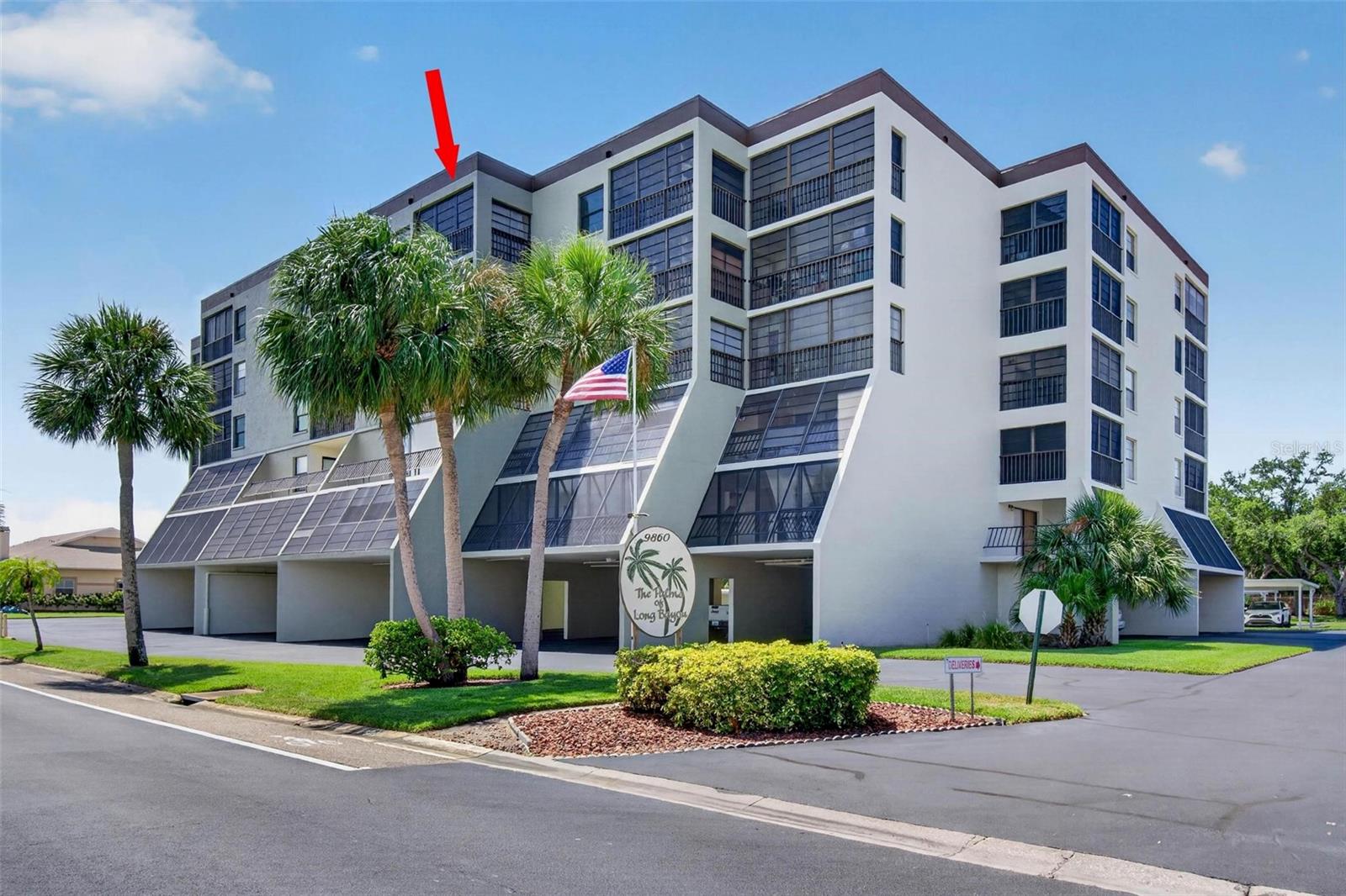 Welcome to The Palms at Long Bayou, where peaceful waterfront surroundings, resort-style amenities, and maintenance-free living come together in one of Pinellas County's most desirable 55+ gated communities. This beautifully maintained, move-in ready 2-bedroom, 2-bath condominium offers a spacious and inviting floor plan designed for both everyday comfort and effortless entertaining.

Natural light fills the open living and dining areas, which flow seamlessly to the enclosed lanai overlooking the tranquil waters and natural beauty of Long Bayou—an ideal setting to enjoy your morning coffee, watch local wildlife, or unwind at the end of the day. The well-appointed kitchen offers ample cabinetry and workspace, while the generous primary suite features a walk-in closet, an ensuite bath with a walk-in shower, and abundant space to create your own private retreat. The comfortable guest bedroom is complemented by a beautifully appointed second bath, also featuring a walk-in shower, providing comfort and convenience for family and friends.

Thoughtful updates provide peace of mind, including impact-rated windows and a new HVAC system in 2024. Additional conveniences include an in-unit washer and dryer and tandem under-building parking (Space #56), offering room for two vehicles.

Perfectly positioned directly across from the community clubhouse, you'll enjoy easy access to the exceptional amenities that make The Palms at Long Bayou such a sought-after destination. Residents enjoy a 24-hour guard-gated entrance, a heated pool and spa, tennis and pickleball courts, shuffleboard, a fitness center, library, BBQ area, billiards room, card room, woodworking shop, and a full calendar of social activities designed to foster an active and engaging lifestyle.
Ideally located just minutes from the Gulf beaches, Seminole City Center, shopping, dining, and vibrant downtown St. Petersburg, this home offers the perfect balance of tranquility and convenience. The C.W. Bill Young VA Medical Center, the Bay Pines National Cemetery, and the Veterans Affairs Medical Center campus are conveniently located just 3.3 miles away (approximately 9 minutes), making this an ideal location for veterans and their families.

Whether you're looking for a seasonal retreat or a year-round residence, this move-in ready home offers an exceptional opportunity to enjoy the best of Florida living in The Palms at Long Bayou—one of Pinellas County's premier 55+ waterfront communities.