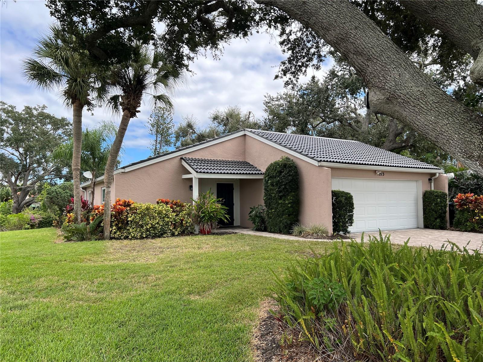 Welcome to Las Casas, a pet-friendly boutique 55+ community of just 22 detached villas, located 8 miles from downtown Sarasota and the Gulf Coast beaches. Nestled on a private cul-de-sac backing onto McArthur Park, this villa offers excellent curb appeal and a peaceful setting. Recently updated, the home features new luxury vinyl plank flooring and has been freshly painted inside and out. The open floor plan includes well-defined living spaces of living room, dining room and a versatile bonus room which leads to a newly paved back patio, where you can relax amid mature landscaping. The primary suite is generously sized, with a walk-in closet and an ensuite bathroom. The split floor plan places the second and third bedrooms on the opposite side of the home, providing privacy for guests or family members. Bedroom three includes built-ins and a Murphy bed, adding functionality to the space. Homes in this desirable community live like single-family residences but are maintained under a condominium model with modest monthly HOA fees. These fees include all lawn care and access to a community pool and clubhouse, conveniently located next door. The clubhouse offers a large social area and a kitchen, ideal for hosting gatherings and events.
This quiet, well-maintained neighborhood is close to SRQ Airport, University Parkway, the Asolo Theatre, and the Ringling Museum, making it a prime location for enjoying Sarasota's cultural attractions. Don’t miss your chance to see this villa. (Some images have been virtually staged for ease of viewing.)
