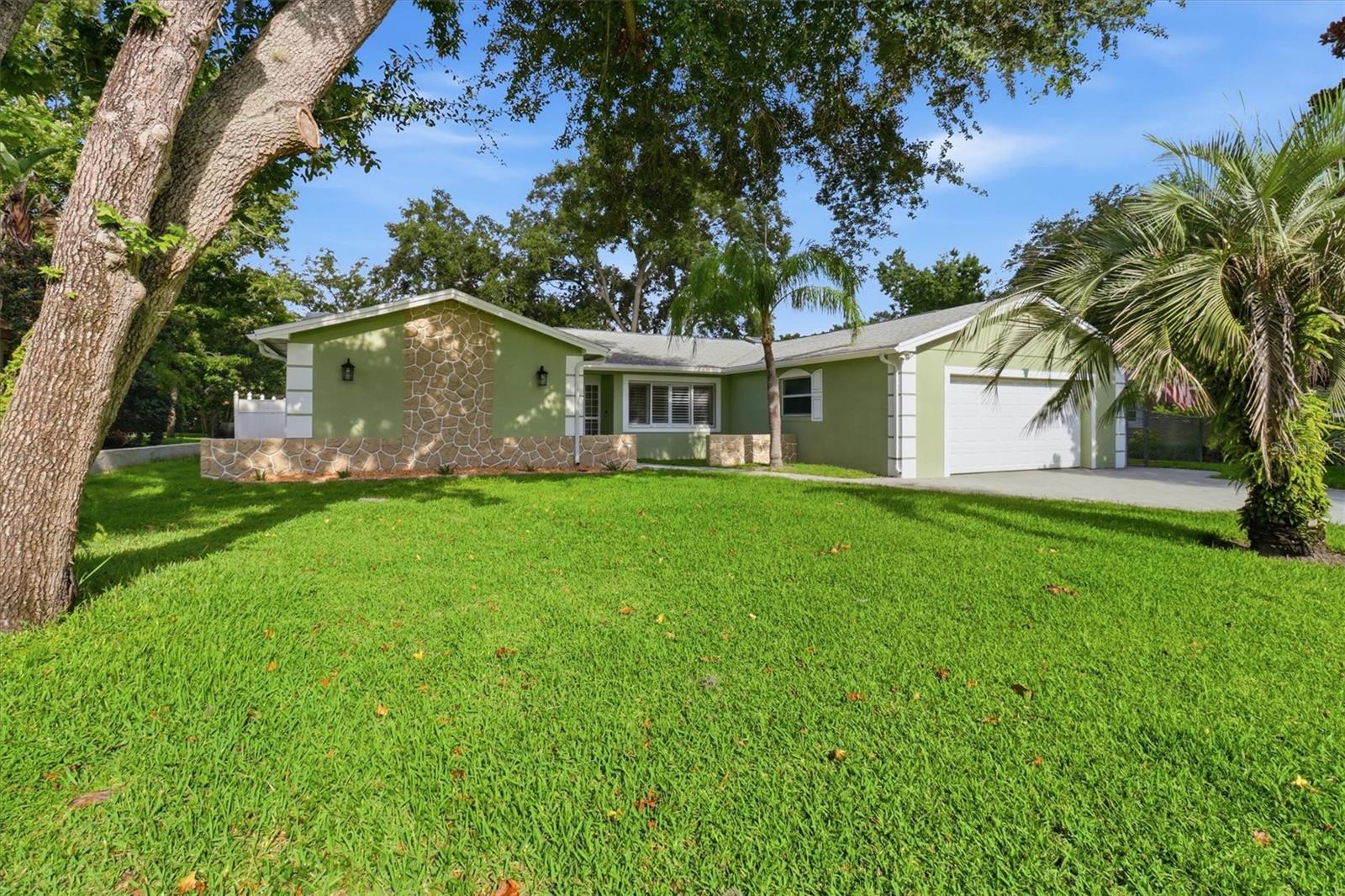 Completely renovated and move-in ready, this beautifully updated 4-bedroom, 2-bath home offers the perfect blend of modern design and comfortable living. The stunning chef's kitchen features sleek contemporary cabinetry, quartz countertops, stainless steel appliances, designer tile backsplash, and a spacious center island ideal for entertaining.

The private primary suite serves as a true retreat with luxury vinyl flooring and a spa-inspired bathroom featuring a freestanding soaking tub, oversized walk-in shower, and modern finishes throughout. The Fourth Bedroom is a versatile flex room perfect for a home office, gym, playroom, or creative studio.

Enjoy Florida living year-round from the expansive screened lanai overlooking a large, fully fenced backyard with mature shade trees, storage shed, and plenty of room for pets, play, entertaining, or a future pool. Recent updates and thoughtful design elements throughout the home create a turnkey opportunity for buyers seeking style, functionality, and outdoor living space.

Conveniently located near shopping, dining, parks, and major commuter routes, this exceptional property offers the best of modern living in an established neighborhood