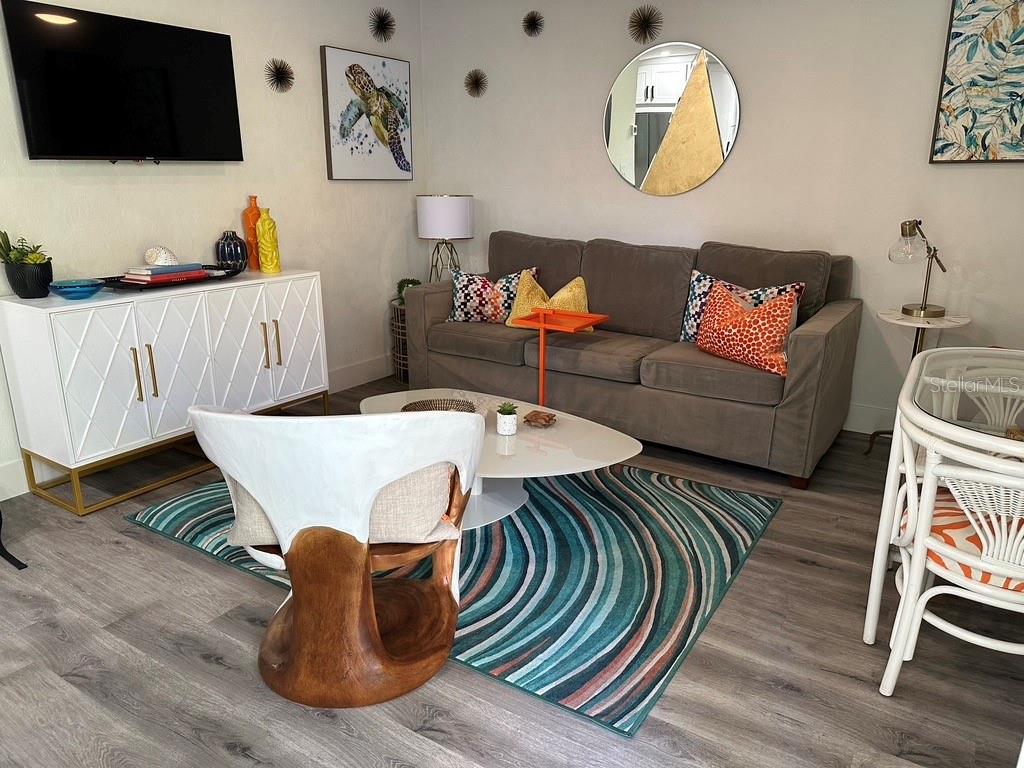 Downtown Sarasota 1BR/1BA in Towles Court Artist Colony in desirable Laurel Park — Furnished or Unfurnished | Walk to Main Street Dog Friendly Modern 1BR/1BA bungalow in the heart of Sarasota's Towles Court Artist Colony — "The Trop" sits in one of the city's most walkable pockets. Step outside to Main Street dining, cafes, nightlife, Whole Foods, the Saturday Farmers Market, Bayfront Park, Marina Jack, Selby Gardens, and Towles Court's galleries and studios. Beaches, St. Armands Circle, Lido, the Ringling, and UTC are a short drive away — park the car and walk to almost everything. Inside: a bedroom, full bath, open-concept living/dining/kitchen, luxury vinyl plank flooring, and a modern kitchen with stainless appliances. The private courtyard adds a grill, string lights, and outdoor dining for eight — ideal for morning coffee or evening cookouts. Offered two ways: Unfurnished, annual (12+ months) — bring your own furnishings and make it home. Furnished, short/mid-term — turnkey for executives, remote workers, snowbirds, or anyone wanting a stylish base. Additional highlights: one dedicated parking space plus ample guest and street parking, free on-site laundry, small dogs considered with owner approval (no cats). Quiet street, right in the middle of downtown life. Pricing varies by furnishing, term, and season — contact agent for current rates and availability.