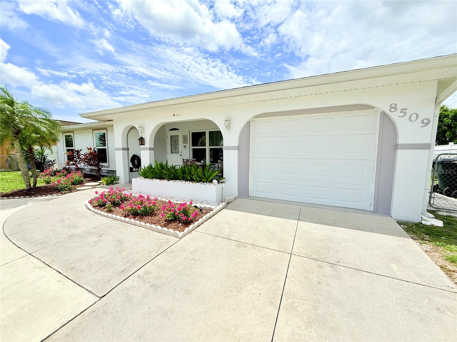 **Welcome to Your Dream Home!** Step into this freshly remodeled modern oasis, where contemporary design meets Florida charm. This stunning 3-bedroom, 2-bathroom residence is a true gem that embodies the essence of relaxed living, just moments away from the beautiful Gulf Coast. As you enter, you'll be captivated by the spacious open layout that seamlessly flows from room to room. The heart of the home is a beautifully redesigned kitchen that has been relocated to the lanai, creating a bright and airy space ideal for culinary adventures. Imagine cooking while basking in sunlight streaming through large windows that overlook your private backyard oasis. The living areas are thoughtfully designed to maximize space and functionality. One unique feature is the converted one-car garage, now a stylish office with its own separate entrance—perfect for working from home or as a private retreat. Should your needs change, this versatile space can easily be transformed into an additional separate bedroom or back to one-car garage with AC. Step outside to discover your personal paradise! The fenced backyard features a charming patio area that's perfect for outdoor dining or simply soaking up the sun. With hurricane windows installed for added peace of mind, you can enjoy Florida's beautiful weather all year round without worry. With great location, NO HOA and NO CDD fees, this property offers incredible convenience with numerous dining options and shopping centers just moments away. NOT in FLOOD ZONE. Attention to investors: this home presents huge potential due to its proximity to Warm Mineral Springs Park - an attraction known for its therapeutic waters - and its suitability for year-round rentals. This home truly encapsulates Florida-style living at its finest! Don’t miss out on making it yours!