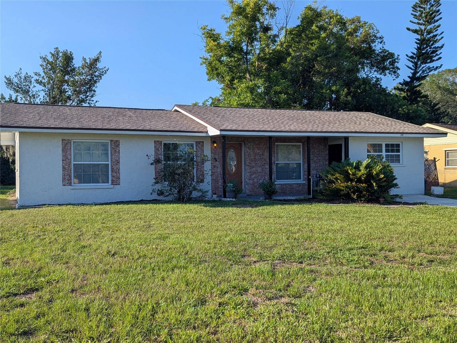 Much desired 3 BR and 2 Bathroom concrete block home!! Make your appointment to view this listing!!! As you enter the front door, this is described and the Living room and dining area combo. Direct entry into the galley kitchen fully equipped with appliances, all fairly new and convey with property. From kitchen area you have immediate access to the laundry room where the hot water ,53 gallon, heater is. The washer and dryer also convey and seller has provided a stand alone shelving for storage. This room also offers a door to the outside for your convenience as well as a seldom seen clothesline!! A step down from laundry area is the extra large room described as the "Family Room".  It's your choice of best way to use i.e... game room, 4th bedroom ( or 4 & 5th with a partition ) . There could be a possibility of Mother in Law suite with some innovated planning. This room also has a door onto the front porch. Doors from dining area take you to the screened lanai that makes serving from kitchen and outdoor bar b que a piece of cake ( no pun ! ) The back yard is nice and easily maintained. There is a well installed in the back yard and Seller also added for great convenience, a hand pump to obtain water if ever needed.  There is a storage shed for all your extras. One last AWESOME part of this property---a new roof!! Please schedule an appointment to view the property.