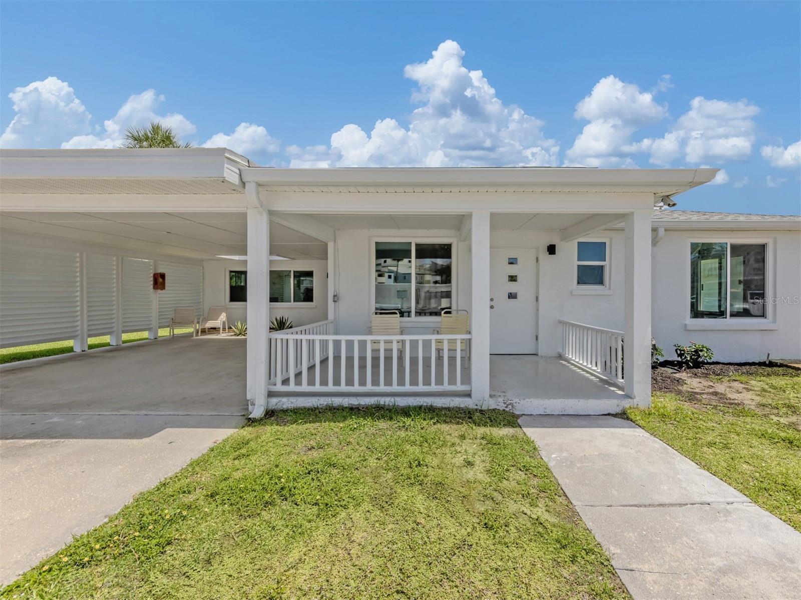 One or more photo(s) has been virtually staged. Island living at its finest! Rarely available, this completely renovated standalone villa offers the privacy and feel of a single-family home with the convenience and low-maintenance lifestyle of a condominium. Ideally on Venice Island, near private deeded beach access, this stunning three-bedroom, two-bath residence has been thoughtfully remodeled from top to bottom with high-end finishes throughout. Recent improvements include impact windows (2022), impact sliding glass doors (2022), a new roof (2023), hurricane-rated front doors (2025) and new HVAC system (2026) providing peace of mind for years to come. The beautifully updated interior features porcelain tile throughout, stainless steel appliances, renovated kitchen and baths, designer finishes and a light, bright coastal atmosphere throughout. The spacious floor plan offers comfortable living and entertaining spaces, with exposed wooden beams, highlighted by a charming wood-burning fireplace, an uncommon and inviting feature for a beachside property. Ample closet space throughout the home provides exceptional storage, while the in-unit washer and dryer combo add everyday convenience. Enjoy your morning coffee or evening cocktail on the private rear patio, offering a peaceful outdoor retreat. Additional features include a private covered carport, generous living space and access to the community pool. For buyers seeking an investment opportunity, this property is especially appealing as it is in one of the few Venice Island communities that permits rentals with a minimum lease period of just seven days, offering exceptional flexibility and income-producing potential. Whether you're looking for a full-time residence, seasonal retreat or investment property, this move-in-ready villa delivers the best of Venice Island living. Spend your days enjoying the private deeded beach access, relaxing by the community pool, or exploring nearby historic downtown Venice with its charming boutiques, restaurants, cultural attractions, farmers market and waterfront parks. Opportunities to own a fully renovated beachside villa with private beach access, short-term rental flexibility, a wood-burning fireplace and premium upgrades are exceptionally rare.