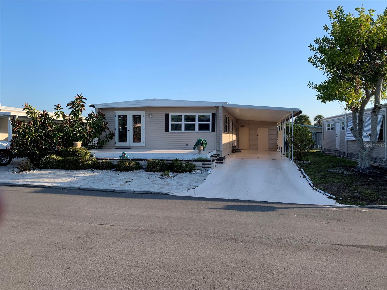 PRICED TO SELL!!! Welcome to this 2 bedroom, 2 bathroom residence in one of the area's most desirable 55+ communities. Designed for both comfort and functionality, this home features a spacious primary suite with three closets, providing exceptional storage, along with a private guest suite perfect for hosting family and friends. With a bright, comfortable layout and access to community amenities, this property offers the ideal blend of relaxation, convenience, and low maintenance living. Newer windows, roof resealed 2025, new stovetop 2025, newer stack top washer and dryer. French Doors lead onto a large front porch 20 x 10. The park amenities are numerous and include2 heated pools, 2 hot tubs, a fitness center, tennis courts, bocce ball, corn hole, horseshoes, billiards, ping pong, game room, Tiki Hut, 2 Clubhouses, and free community bus transportation to local shops and outings. There are also numerous activities and social events for all community members to take part in. The low HOA fee includes Cable TV and Internet, Lawn Maintenance and all amenities. Located just minutes from downtown Venice and pristine beaches with easy access to shopping, dining, and other entertainment options. Whether you are enjoying a sunset stroll on the beach or exploring the charm of downtown Venice, this location offers the best of Florida living.