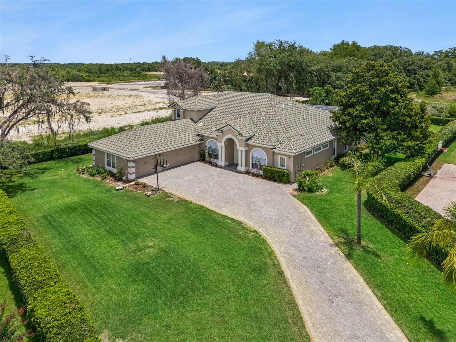 Welcome to this exceptional luxury residence offering 5 spacious bedrooms, 4 beautifully appointed bathrooms, and 3,929 square feet of refined living space on an expansive homesite of over half an acre. Perfectly positioned in a highly sought-after location, this stunning property combines elegance, comfort, and privacy with resort-style outdoor living. Surrounded by lush, mature landscaping, the home makes a striking first impression and provides a serene setting for everyday living. Inside, thoughtfully designed interiors feature generous living and entertaining spaces, abundant natural light, and sophisticated finishes throughout. The spacious layout seamlessly accommodates both intimate family gatherings and large-scale entertaining. The outdoor retreat is equally impressive, highlighted by a sparkling pool and expansive patio areas ideal for relaxation and year-round enjoyment. The oversized lot offers exceptional privacy while providing ample space for outdoor activities and future enhancements. Residents enjoy access to outstanding community amenities and the convenience of a prime location close to premier shopping, dining, entertainment, top-rated schools, and major transportation routes. Offering an unparalleled blend of luxury, space, and lifestyle, this remarkable property presents a rare opportunity to own a distinguished home in one of the area’s most desirable communities. You're also nestled within a well-established community, this property enjoys an enviable location close to major highways, ensuring convenient access to all amenities. Just minutes away, residents can indulge in excellent shopping opportunities, dine at a variety of luxury and casual eateries, and explore nearby theme parks for entertainment. The neighborhood benefits from proximity to brand-new, state-of-the-art hospitals and a top notch school system, providing peace of mind for residents seeking quality healthcare services and high end education for their family. This vibrant community offers an abundance of options to suit every lifestyle need and preference. Call today to schedule a private tour.