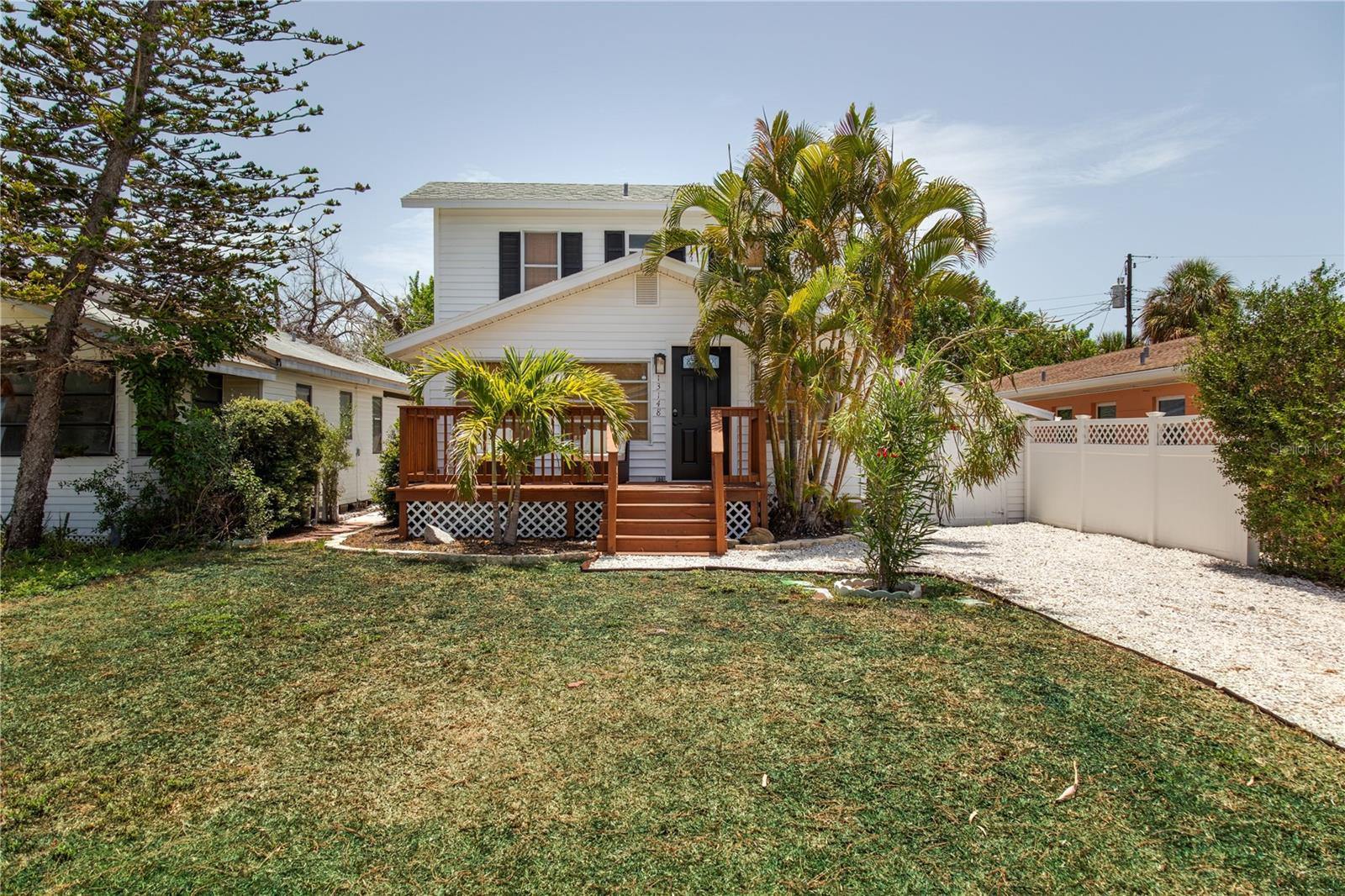 Live the Florida beach lifestyle in this beautifully updated 3-bedroom, 2-bathroom home in Madeira Beach, ideally located just one-third of a mile from beach access and only half a mile from the popular Johns Pass Village & Boardwalk. Offering the perfect combination of coastal charm and modern updates, this home places you close to the Gulf's sandy shores, waterfront dining, boutique shopping, and endless entertainment options. Freshly updated with permits in 2025, this move-in-ready home features new flooring, new countertops, and brand-new decking on the upstairs patio, rear deck, and front porch. Additional improvements include professionally cleaned air ducts and a newer HVAC system installed in 2024, providing comfort and peace of mind. Inside, you'll find a bright and inviting floor plan featuring a welcoming front sitting room and a living and dining room combination. The beautifully remodeled kitchen showcases stainless steel appliances, a center island perfect for meal prep or casual dining, stylish pendant lighting, and modern finishes throughout. All three bedrooms are conveniently located upstairs, creating a private retreat away from the main living areas. The primary bedroom features its own private balcony, offering the perfect place to enjoy your morning coffee or unwind after a day at the beach. A full bathroom is conveniently located downstairs, while an additional full bathroom upstairs serves the bedroom level. Step outside and enjoy multiple outdoor living spaces, including the upstairs balcony and backyard patio, featuring an outdoor shower, perfect for entertaining family and friends or simply embracing the laid-back coastal lifestyle. Whether you're looking for a primary residence, vacation getaway, or investment opportunity, this exceptional Madeira Beach home offers an unbeatable location just moments from the beach and all the charm of one of Tampa Bay's most sought-after beach communities. Schedule your showing today!
