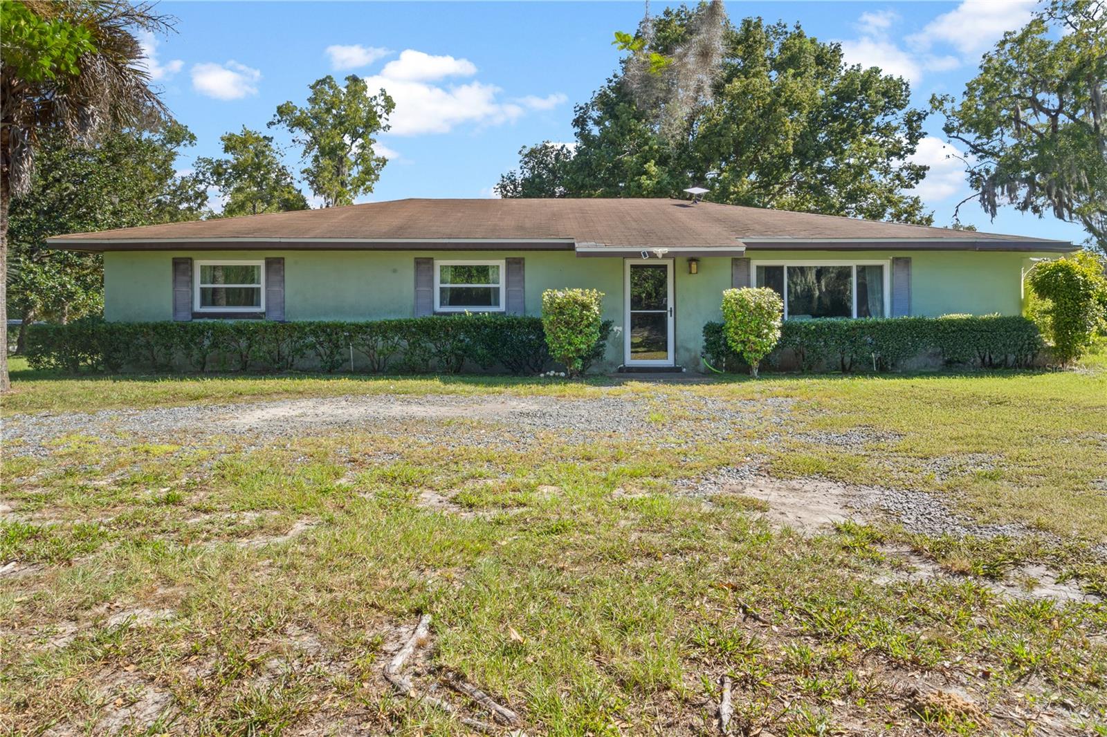 NEW PRICE – $335,000! MINI FARM OPPORTUNITY ON NEARLY 5 FENCED ACRES IN MORRISTON! Bring your horses, animals, tools, and vision to this 3BR/2BA home situated on beautiful usable acreage with paddocks already in place and nearby access to the trails of Goethe State Forest.
This 1,728 SF home offers a semi-open floor plan, updated windows, newer appliances, and a solid start for someone ready to put in a little work and make it their own. While some repairs and cosmetic updates are needed, the hard-to-find combination of usable fenced acreage, location, and functionality creates incredible potential at this price point.
The property is fenced and cross-fenced with room for horses, livestock, RVs, gardening, hobby farming, or simply enjoying peaceful country living. Scattered trees provide shade and privacy, and there’s no HOA or deed restrictions to limit your plans.
If you’ve been watching and waiting for the right mini farm opportunity in this area, this price improvement may be the sign to come take a second look and imagine the possibilities for yourself.