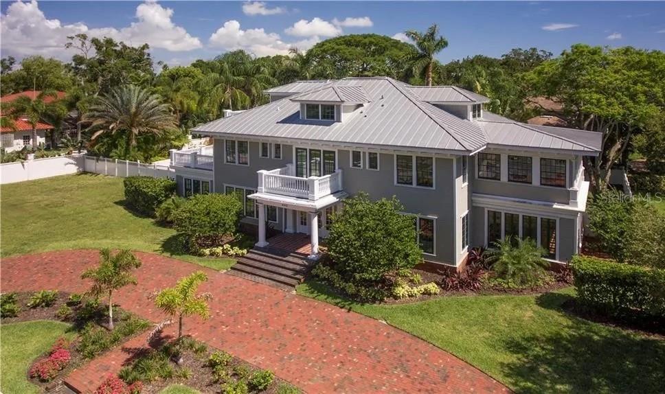 Welcome to 403 Magnolia Dr., a stunning Colonial Revival home located in the renowned 'Florida Heritage' neighborhood of Harbor Oaks, nestled in downtown Clearwater. This exceptional property, built between 1918 and 1925, has been thoughtfully restored, updated, and modernized to offer the epitome of elegance. With 9,644 square feet of living space, this residence boasts 7 bedrooms, 7.5 bathrooms, and exquisite hardwood flooring throughout.

Step inside and be greeted by the grandeur of the east and west formal living rooms, bathed in natural light streaming through the floor-to-ceiling windows. This home is designed for effortless entertaining, offering a sun-filled solarium, a cozy library, a spacious family room, and a formal dining room. The deluxe kitchen is a culinary enthusiast's dream, featuring top-of-the-line stainless steel appliances, a Dacor gas oven and range, and a convenient walk-in pantry. The first level also includes a generous laundry room that leads to the maid quarters.

Ascending to the second level, you will discover two master bedrooms, each with private access to the expansive wrap-around deck and lanai. These master bedrooms boast luxurious 'Restoration' style bathrooms, exuding elegance and sophistication. Adjacent to the master suites, you will find several guest rooms and a bright Moroccan-themed living room, creating a tranquil and inviting atmosphere.

Continuing to the third level, a magnificent master-style in-law suite awaits, complete with a full bathroom, a cozy fireplace, a sun deck, and multiple storage rooms. The home is situated on over half an acre of meticulously landscaped grounds, showcasing an elegant tropical pool and spa deck, offering a private oasis to relax and unwind.

Conveniently located, this home allows for easy access to downtown Clearwater, where you can explore a multitude of shopping, dining, and entertainment options. Additionally, the world-famous Clearwater Beach is just a short five-minute drive away. All measurements provided are approximate, and buyers are encouraged to verify them.

Experience the pinnacle of refined living at 403 Magnolia Dr., where timeless elegance and modern comforts seamlessly blend together to create a truly remarkable home. “Rent-to-Buy” option would be considered.