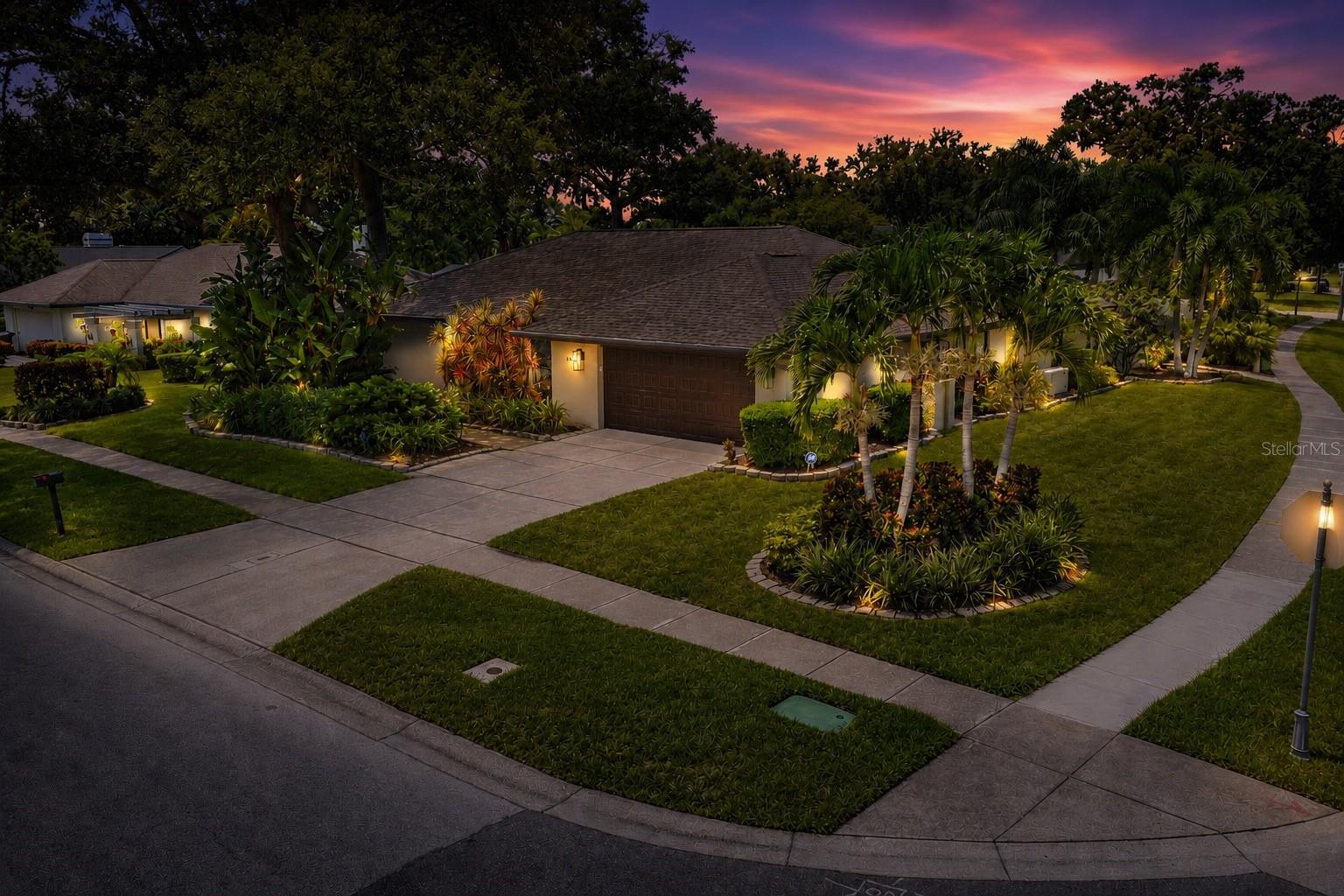 Ideally located in one of the Tampa Bay area's most sought-after communities, this exceptional home offers convenient access to everything the region has to offer, including beautiful Gulf beaches, premier shopping, outstanding restaurants, and both Tampa International and St. Pete-Clearwater airports. Situated on an expansive corner lot with mature landscaping, the property boasts exceptional curb appeal and outstanding backyard privacy, enhanced by durable vinyl fencing.Designed for enjoying Florida's year-round outdoor lifestyle, the heated pool and spa create the perfect setting for entertaining or relaxing in your own private retreat. The spacious covered lanai provides a welcome escape from the sun, while retractable sunshades add an extra level of comfort for outdoor living.
Enter through elegant French doors into the inviting family room and kitchen, where the open-concept design is enhanced by warm knotty pine ceilings and a cozy gas fireplace that creates an atmosphere of comfort and character. The well-appointed kitchen features a large snack bar and a sunny breakfast nook, providing abundant space for casual dining, family gatherings, and entertaining. The marble look tile and back splash enhance the extended bank of wood cabinets for plenty of storage.
A thoughtfully designed split-bedroom floor plan offers privacy for family and guests, with the spacious primary suite serving as a true retreat. The luxurious primary ensuite is complemented by direct access to the pool and covered lanai, allowing you to enjoy seamless indoor-outdoor living. An oversized laundry room conveniently located just off the kitchen provides exceptional storage and everyday functionality.
Meticulously maintained and thoughtfully updated, this home offers peace of mind with an impressive list of recent improvements, including a Generac generator (2025), chimney cap (2025), roof in (2022),HVAC system (2025), water heater (2024), Rain Bird sprinkler control panel (2026), pool pump (2025), garage door motor (2025), pool cleaner, pool relief valve, pool filter and core (2026), dishwasher (2026), and many additional upgrades. This move-in-ready home combines timeless comfort, quality improvements, and an unbeatable location to create an exceptional opportunity.
