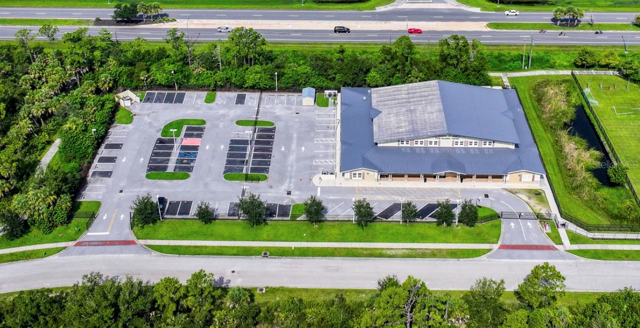 This multi-purpose flex building, located in the rapidly growing city of North Port, offers 16,212 square feet of versatile space. Zoned Activity Center (AC), the property offers exceptional flexibility for a wide variety of commercial and industrial uses, including warehouse, light industrial, self storage, brewery, bank, recreation, and more. 

Currently configured as a recreational facility, the building features a large clear-span central space complemented by multiple perimeter rooms that can be easily repurposed as private offices, conference rooms, break areas, storage, or support space. The existing layout provides an excellent foundation for businesses seeking functional industrial space with built-in administrative areas while minimizing renovation costs.

The property is conveniently located just off Toledo Blade Boulevard, with direct access from Sycamore Street, allowing for efficient traffic flow and ease of access. Toledo Blade Boulevard serves as one of North Port's primary north-south corridors, providing direct connectivity to Interstate 75 to the north and US-41 (Tamiami Trail) to the south. This strategic location places the property within approximately one hour of St. Petersburg, Bradenton, Sarasota, Arcadia, Punta Gorda, and Fort Myers, making it an ideal location for regional operations, distribution, or service-based businesses.