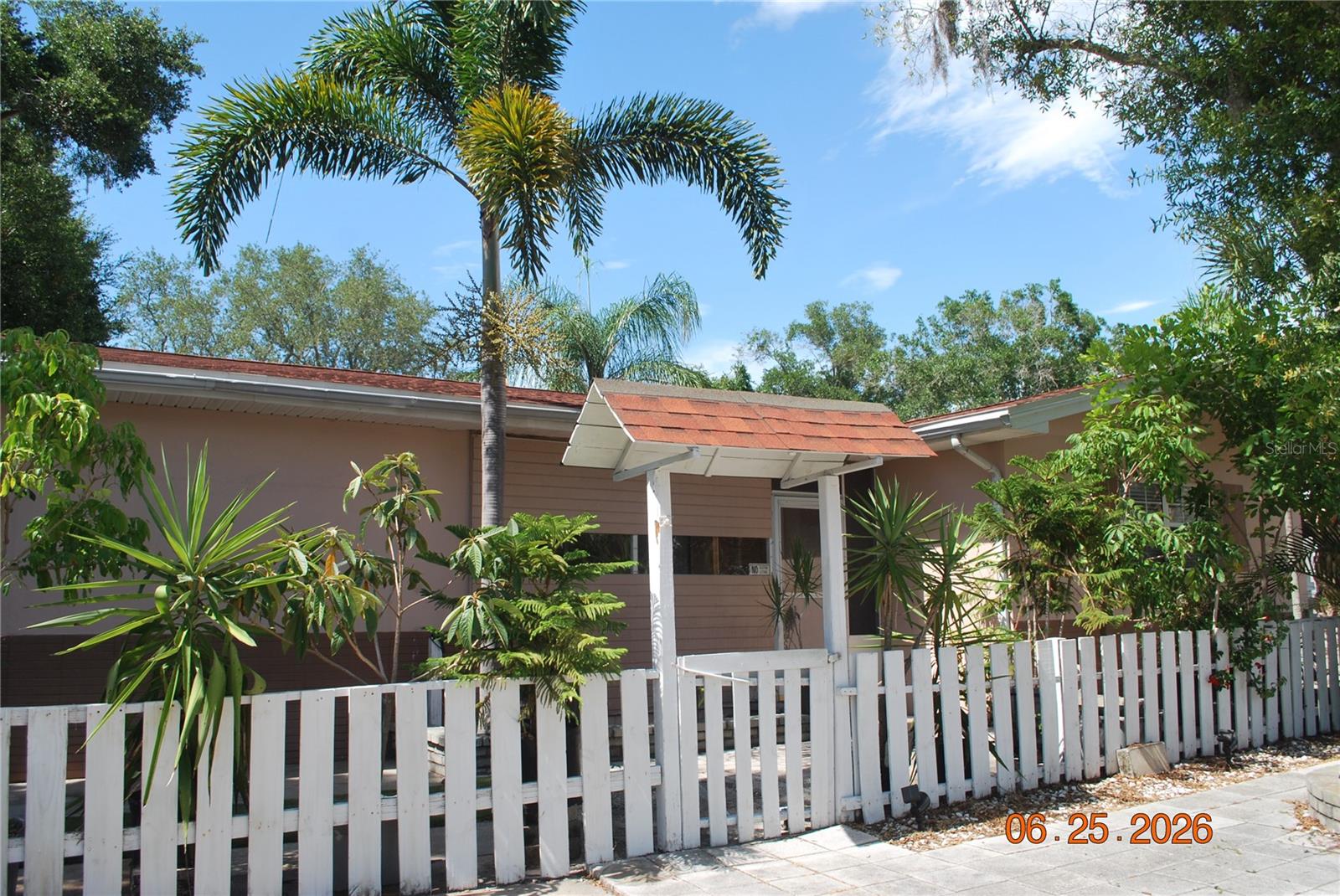 POOL home!  Less than 3 miles from beaches! Convenient location close to shopping, restaurants and top-rated schools. 3 Bedroom split plan with 2 baths. Inside utility room. Great room plan.   Tile, laminate & terrazzo flooring.  Roof is 3 years old. Updated kitchen with newer stainless appliances. Tiled, screened patio. Oversized lot with plenty of room to park recreational vehicles. 2 air-conditioned storage buildings.  No HOA
