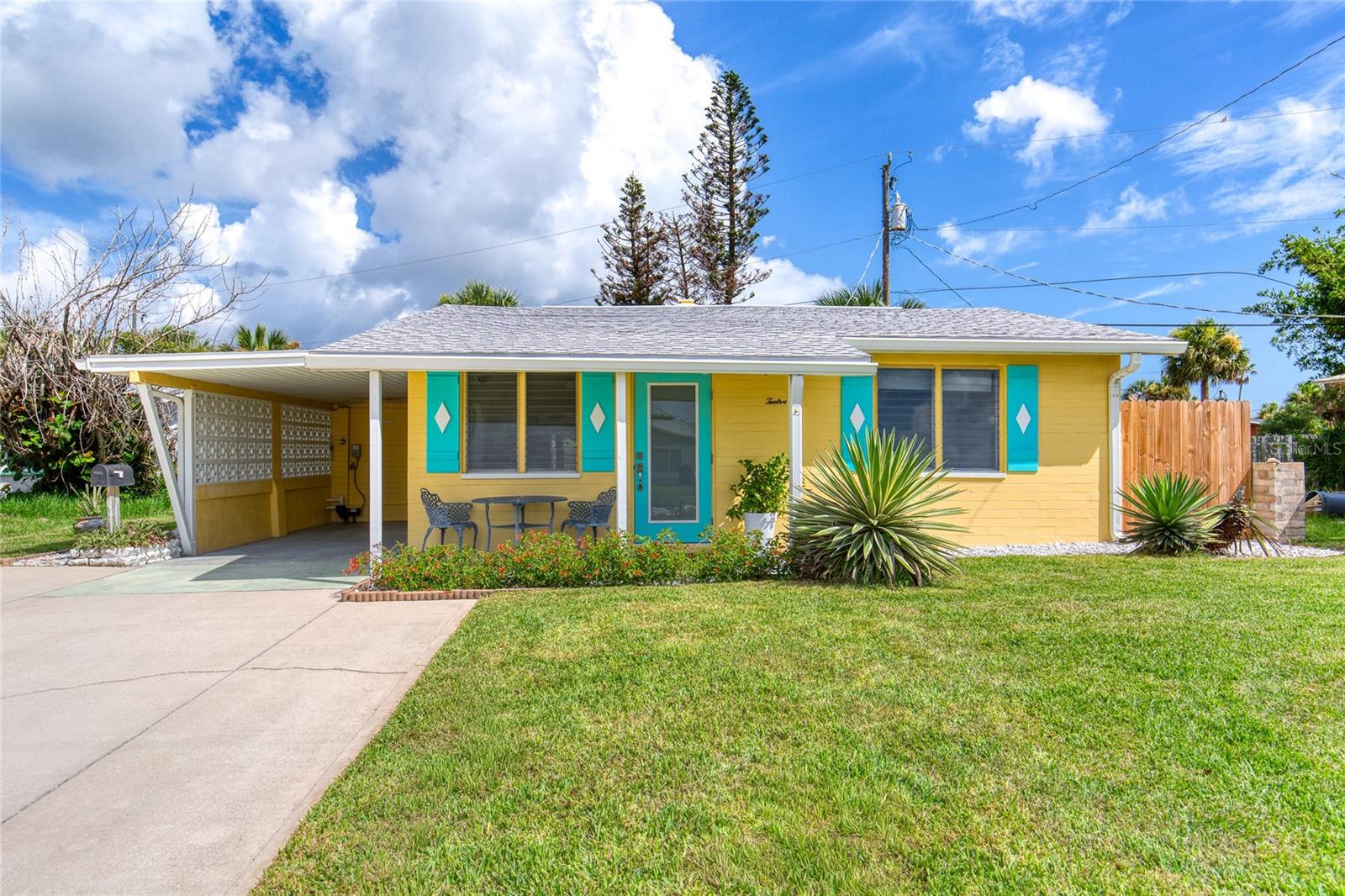 Paradise calls! This three bed, two bath mid-century charmer with modern flair is mere steps from the beach and has been thoughtfully updated with a new roof, new HVAC system, new irrigation well, pump, irrigation system, fresh landscaping, new interior and exterior paint, and a beautiful new hurricane impact grade front entry door.

A covered carport and extra-wide driveway provide ample parking for two vehicles. Out back, you'll find a private, fully fenced backyard complete with a covered lanai and fully wired outbuilding shed — the perfect setting for morning coffee, evening cocktails, crafty projects or unwinding after a day at the beach. River-stone edgings lead to an inviting, tucked-away side patio, perfect for bonus cookout seating or to simply take a quiet moment to yourself. 

Enjoy an easy walk to local restaurants, shopping, and neighborhood pubs along famous A1A. A crosswalk at the end of the street leads directly into Tom Rennick Park, where you'll find picnic pavilions, outdoor showers, restrooms, a lifeguard station, and convenient access to the area's beautiful no-drive beach for carefree days in the sun and surf. 

A public fishing pier and kayak launch on the Intracoastal Waterway are located just at the other end of the street.

This home is move-in ready, with room to shape your vision of your perfect Florida beach home.

Square footage received from tax rolls. All information recorded in the MLS intended to be accurate but cannot be guaranteed.