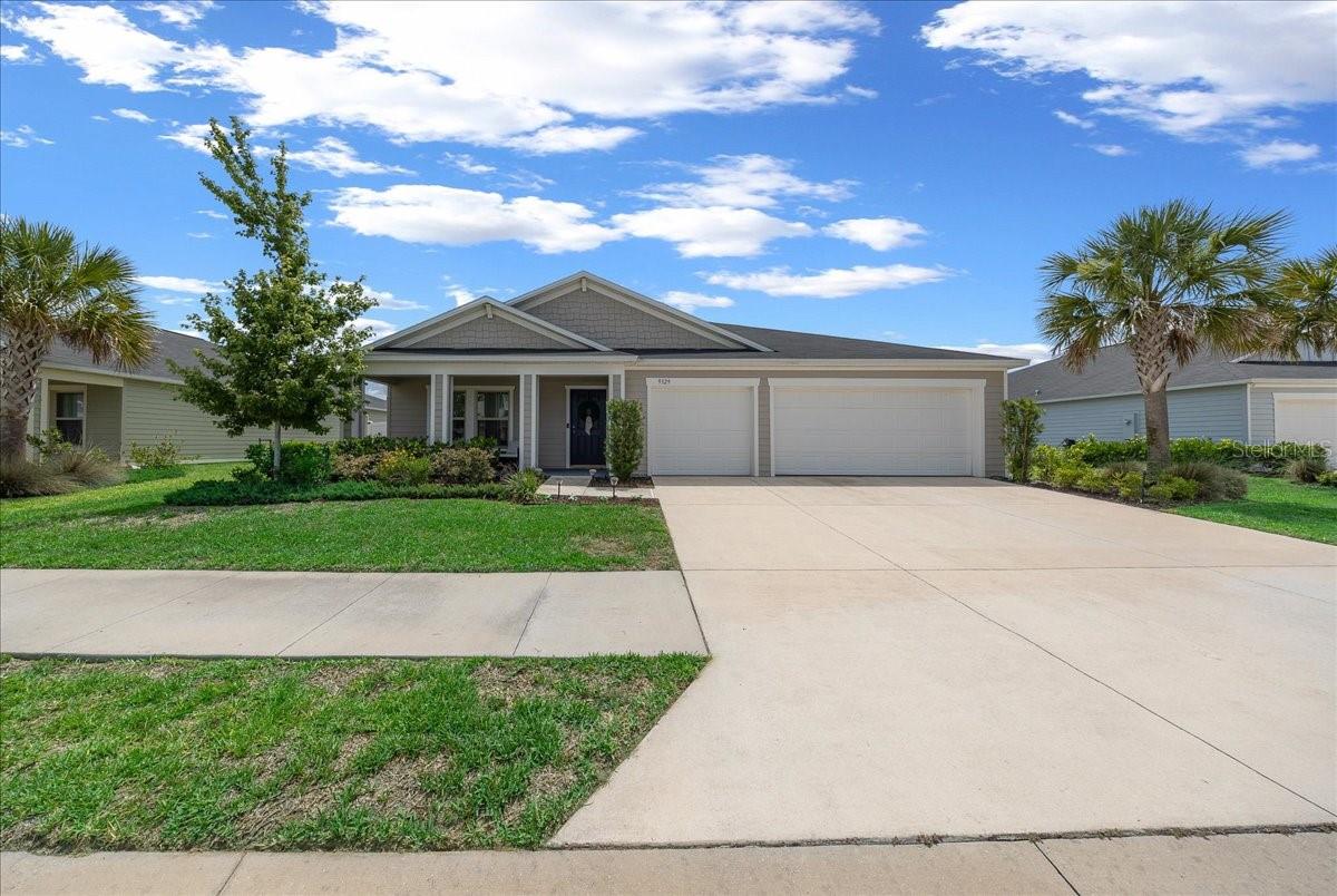 Built in 2022, this 4-bedroom, 2-bath home with a dedicated den offers 2,283 living sq ft and a functional split-bedroom layout in the sought-after Freedom Crossings Preserve community in Ocala. The open-concept design connects the spacious living, dining, and kitchen areas, creating an ideal setup for everyday living and entertaining. The kitchen features granite countertops, abundant cabinet space, a large pantry, and easy flow into the main living areas with tile flooring throughout. Bedrooms include carpet for added comfort, while the primary suite offers a large walk-in closet and private bath. Situated on approximately .21 acres, includes a vinyl-fenced backyard and a welcoming covered front porch perfect for relaxing outdoors year-round. The 3-car garage provides extra storage and parking flexibility. Freedom Crossings Preserve offers sidewalks throughout the neighborhood, a community pool, and low HOA fees of just $85 per month. Conveniently located near shopping, hospitals, schools, dining, and major Ocala conveniences.