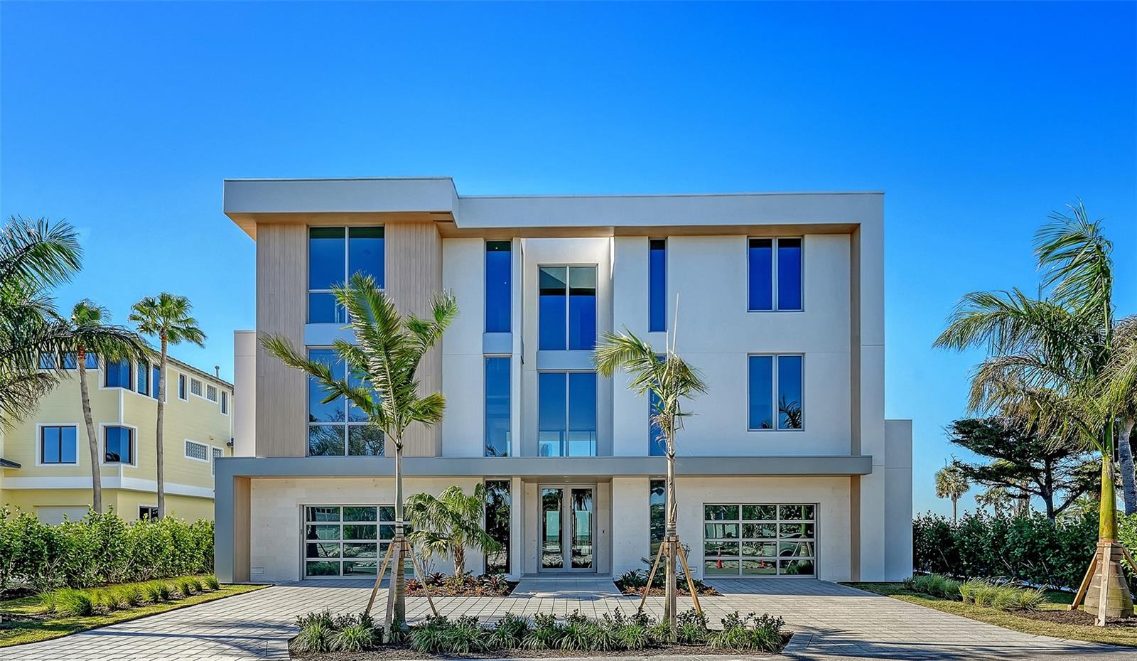 This Seaward Homes Curated Collection residence at 6489 Gulfside is ready for occupancy. Enjoy the ultimate Longboat Key lifestyle with your own direct Gulf-front private access and stunning views of the Gulf of Mexico. Designed by DSDG Architects, this home epitomizes exceptional quality and attention to detail. Come and witness the cutting edge of enhanced hurricane construction, wander and enjoy the exquisite staging by Clive Daneil Homes. 
Situated on a coveted 90' Gulf/Beach-front lot, the property offers soft sands, endless Gulf views, and miles of walkability.  
In 2025, Longboat Key completed a significant beach re-nourishment project, giving Gulfside Road homeowners one of the widest and deepest stretches of beach on the entire island. Equally notable, Gulfside Road is one of the rare Gulf-side streets set back from the main highway, offering a tranquil, private environment that feels worlds away from the activity of Gulf of Mexico Drive.
The main house, elevated over 15 feet, features 11' ceilings, four oversized en-suite bedrooms, and more than 6,600 sq ft of air-conditioned living space, including a grade-level, air-conditioned multipurpose room that can be tailored for wellness, fitness, or a variety of additional lifestyle needs.
The wide-open floor plan, generous room sizes, and large impact-rated safety glass sliding doors and windows fill the home with natural light. Two nearly 40' terraces on the main and second floors provide ideal spaces to enjoy the outdoor island lifestyle and breathtaking Gulf views.
Interior finishes by Studio G Homes elevate luxury living to the next level. The interior finishes include large-format porcelain tile and hardwood flooring, Italian-imported cabinetry, a custom floating steel-and-wood staircase, a three-stop elevator, 8' solid interior doors, high-efficiency mechanical systems, a top-of-the-line Thermador™ appliance package, AXOR™ and Hansgrohe™ plumbing fixtures, temperature-controlled wine storage, and detailed AV, lighting control, and security systems.
Exterior features include solid concrete and masonry construction on all floors, a deep concrete piling foundation for added strength, Longboard™ premium aluminum architectural details, and a fine light-sand exterior stucco finish. The resort-like pool area and custom spa are surrounded by a lush tropical landscape package. The garage accommodates four cars, with the option to add car lifts.
Longboat Key, an 11-mile barrier island, is just minutes from St. Armands Circle and downtown Sarasota. The Sarasota Bradenton International Airport is approximately 25 minutes away. Embrace the opportunity to own this unparalleled residence and experience the pinnacle of coastal luxury living.