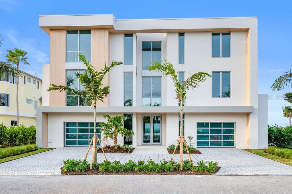This Seaward Homes Curated Collection residence at 6489 Gulfside is ready for occupancy. Enjoy the ultimate Longboat Key lifestyle with your own direct Gulf-front private access and stunning views of the Gulf of Mexico. Designed by DSDG Architects, this home epitomizes exceptional quality and attention to detail. Come and witness the cutting edge of enhanced hurricane construction, wander and enjoy the exquisite staging by Clive Daneil Homes. 
Situated on a coveted 90' Gulf/Beach-front lot, the property offers soft sands, endless Gulf views, and miles of walkability.  
In 2025, Longboat Key completed a significant beach re-nourishment project, giving Gulfside Road homeowners one of the widest and deepest stretches of beach on the entire island. Equally notable, Gulfside Road is one of the rare Gulf-side streets set back from the main highway, offering a tranquil, private environment that feels worlds away from the activity of Gulf of Mexico Drive.
The main house, elevated over 15 feet, features 11' ceilings, four oversized en-suite bedrooms, and more than 6,600 sq ft of air-conditioned living space, including a grade-level, air-conditioned multipurpose room that can be tailored for wellness, fitness, or a variety of additional lifestyle needs.
The wide-open floor plan, generous room sizes, and large impact-rated safety glass sliding doors and windows fill the home with natural light. Two nearly 40' terraces on the main and second floors provide ideal spaces to enjoy the outdoor island lifestyle and breathtaking Gulf views.
Interior finishes by Studio G Homes elevate luxury living to the next level. The interior finishes include large-format porcelain tile and hardwood flooring, Italian-imported cabinetry, a custom floating steel-and-wood staircase, a three-stop elevator, 8' solid interior doors, high-efficiency mechanical systems, a top-of-the-line Thermador™ appliance package, AXOR™ and Hansgrohe™ plumbing fixtures, temperature-controlled wine storage, and detailed AV, lighting control, and security systems.
Exterior features include solid concrete and masonry construction on all floors, a deep concrete piling foundation for added strength, Longboard™ premium aluminum architectural details, and a fine light-sand exterior stucco finish. The resort-like pool area and custom spa are surrounded by a lush tropical landscape package. The garage accommodates four cars, with the option to add car lifts.
Longboat Key, an 11-mile barrier island, is just minutes from St. Armands Circle and downtown Sarasota. The Sarasota Bradenton International Airport is approximately 25 minutes away. Embrace the opportunity to own this unparalleled residence and experience the pinnacle of coastal luxury living.