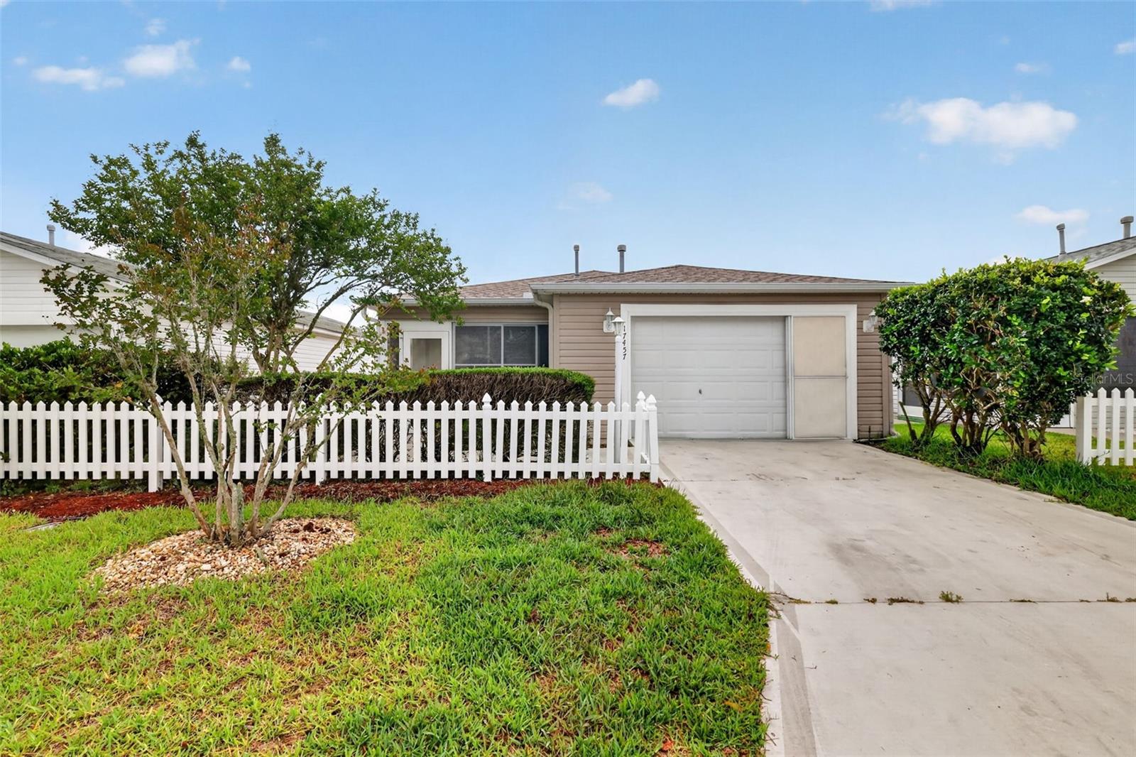 Virtually Staged. Welcome to this charming Colony Patio Villa with NO BOND! This home features wood and tile flooring throughout — no carpet anywhere. Major updates include a NEW ROOF in 2021 and a NEW GAS HOT WATER HEATER in 2020 for added peace of mind. 

The kitchen and bathrooms showcase granite countertops, while the kitchen also offers pull-out shelving, stainless steel appliances, and a gas stove perfect for those who love to cook.

Start your mornings relaxing with a cup of coffee on the enclosed lanai. Conveniently located just a golf cart ride from Nancy Lopez Legacy Country Club and minutes from the First Responders Recreation Center, the VA, Publix, restaurants, shopping, and salons.

This home combines comfort, style, and convenience in one desirable location — perfect for enjoying The Villages lifestyle!